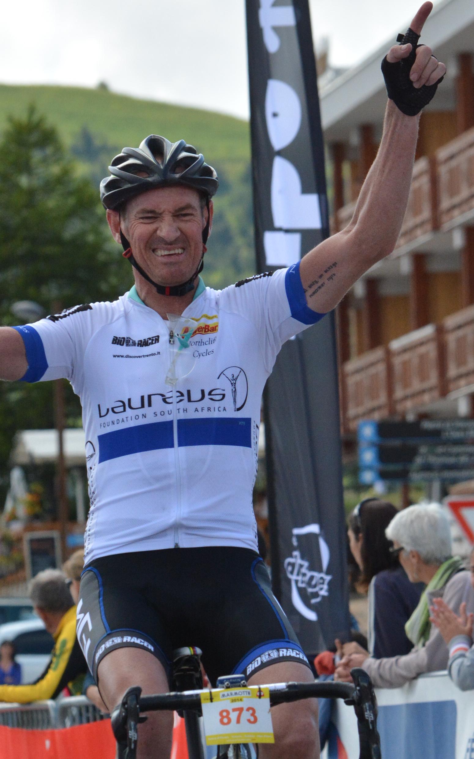 Man celebrating on bicycle
