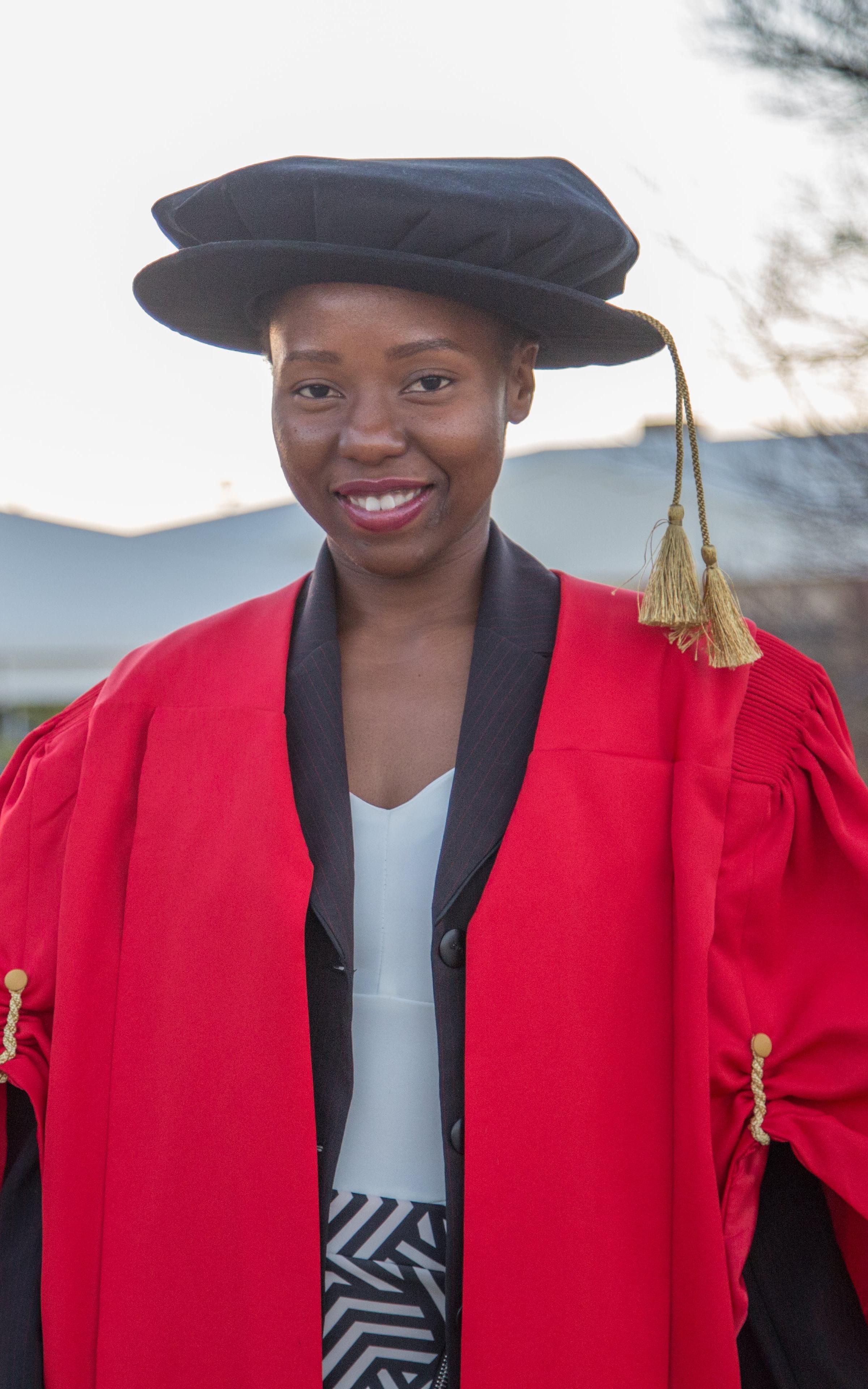 Woman in graduation gear.