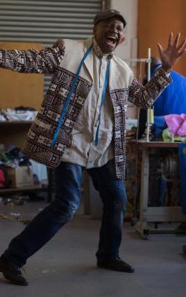 Man dancing in his studio.