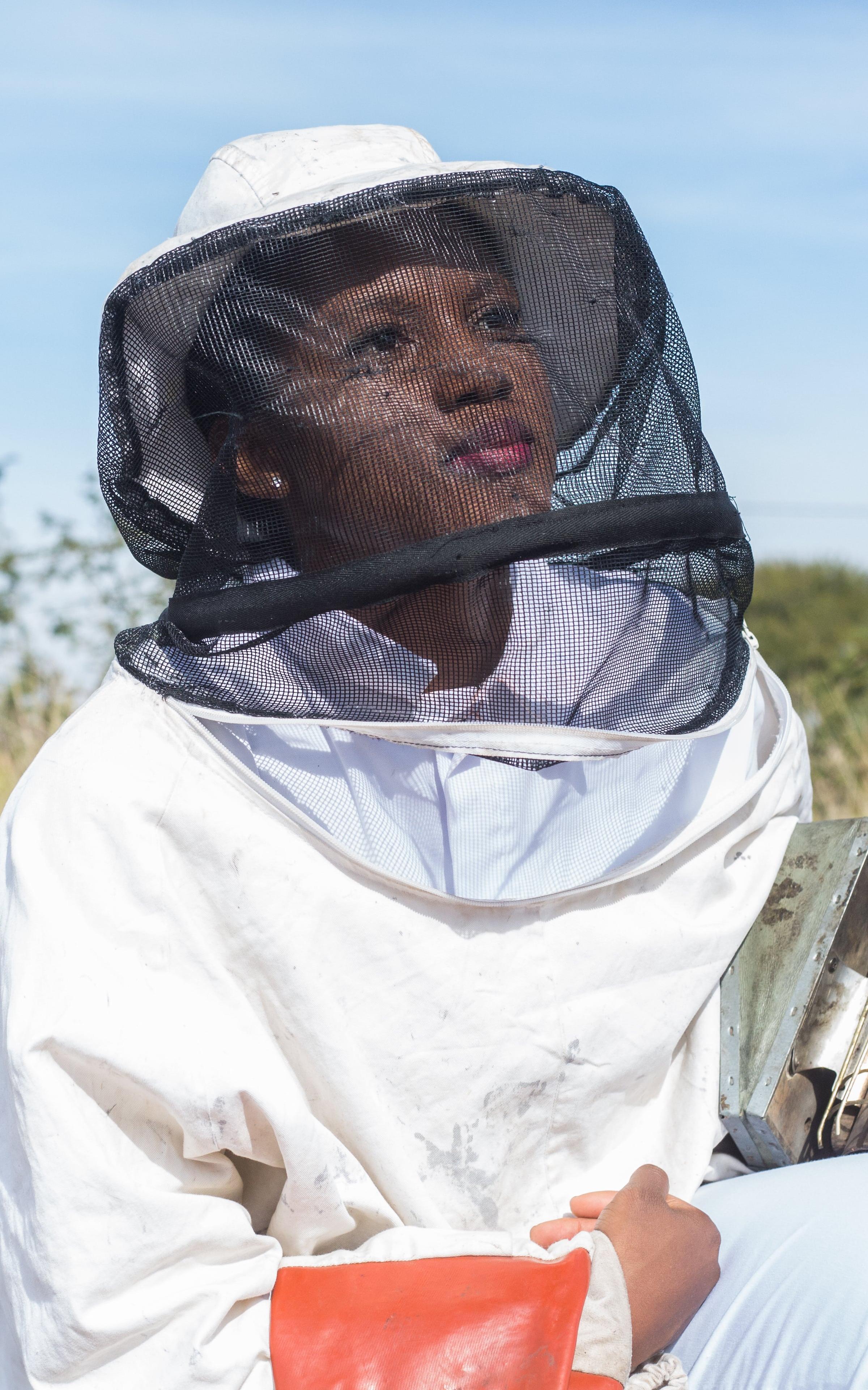 Woman wearing a beekeeping outfit