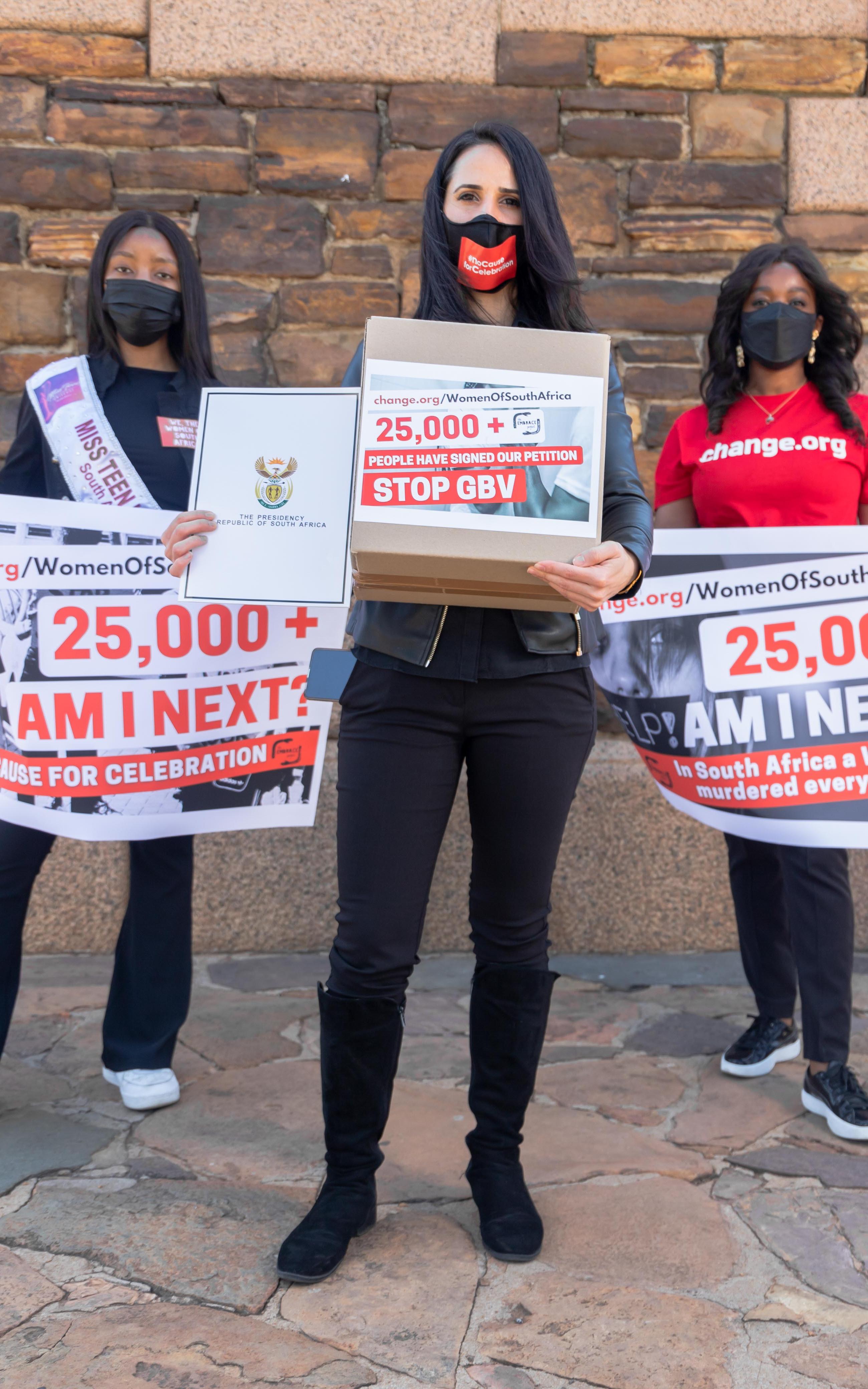 Beautiful News-Women holding protest banners. 