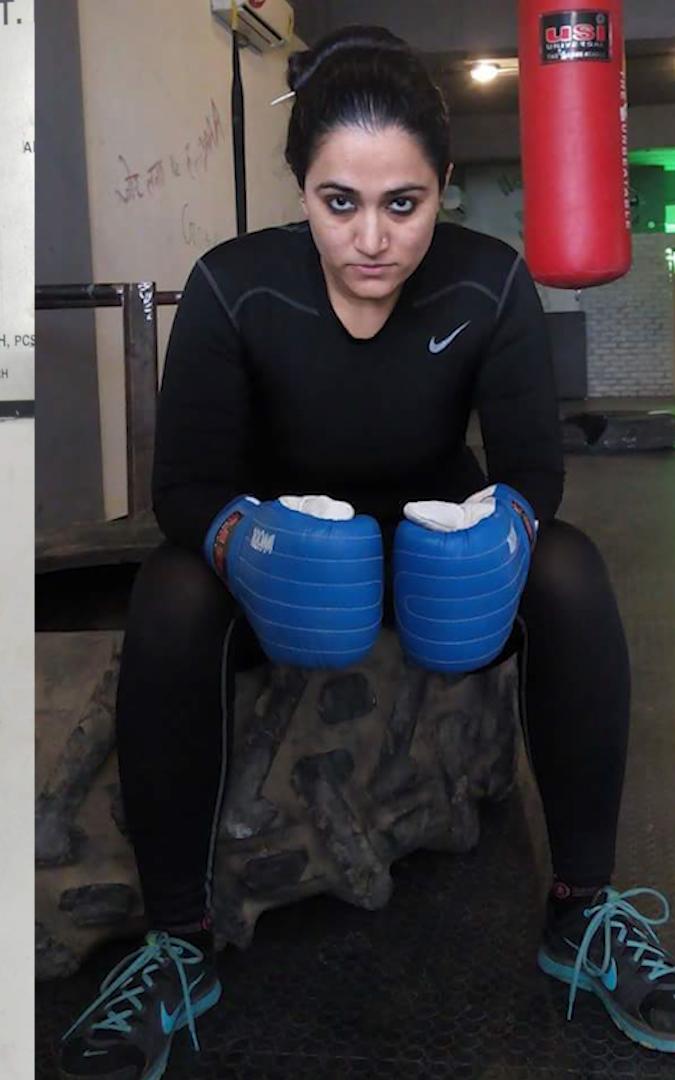 Woman in boxing gear.