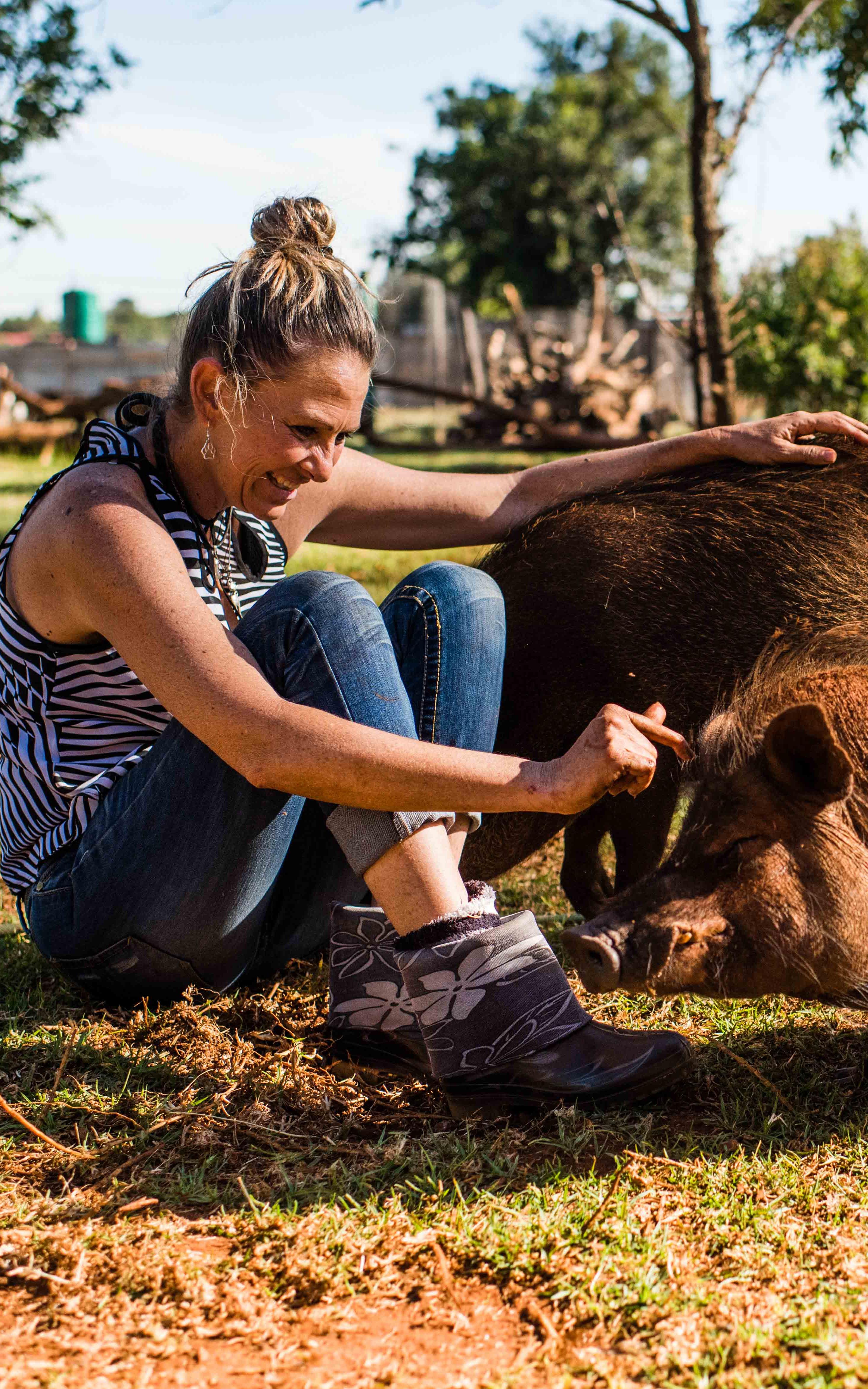 Woman with two pigs