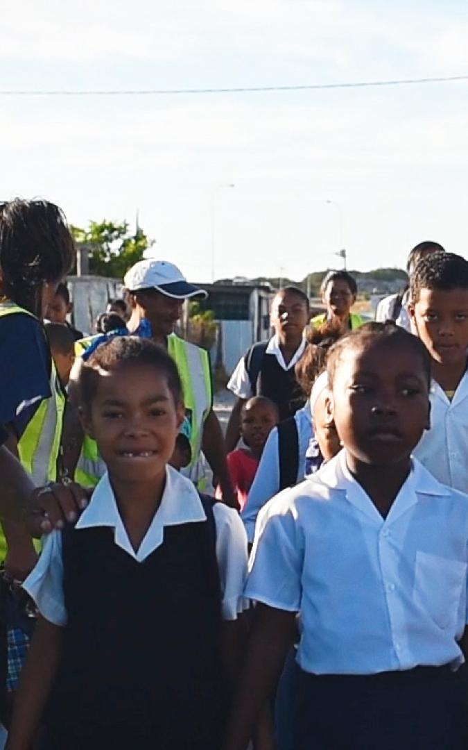 Neighbourhood Watch walking a group of children to school
