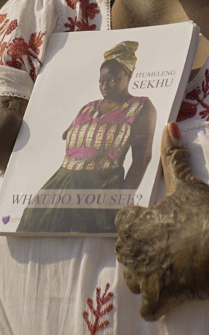 Burnt hands holding book