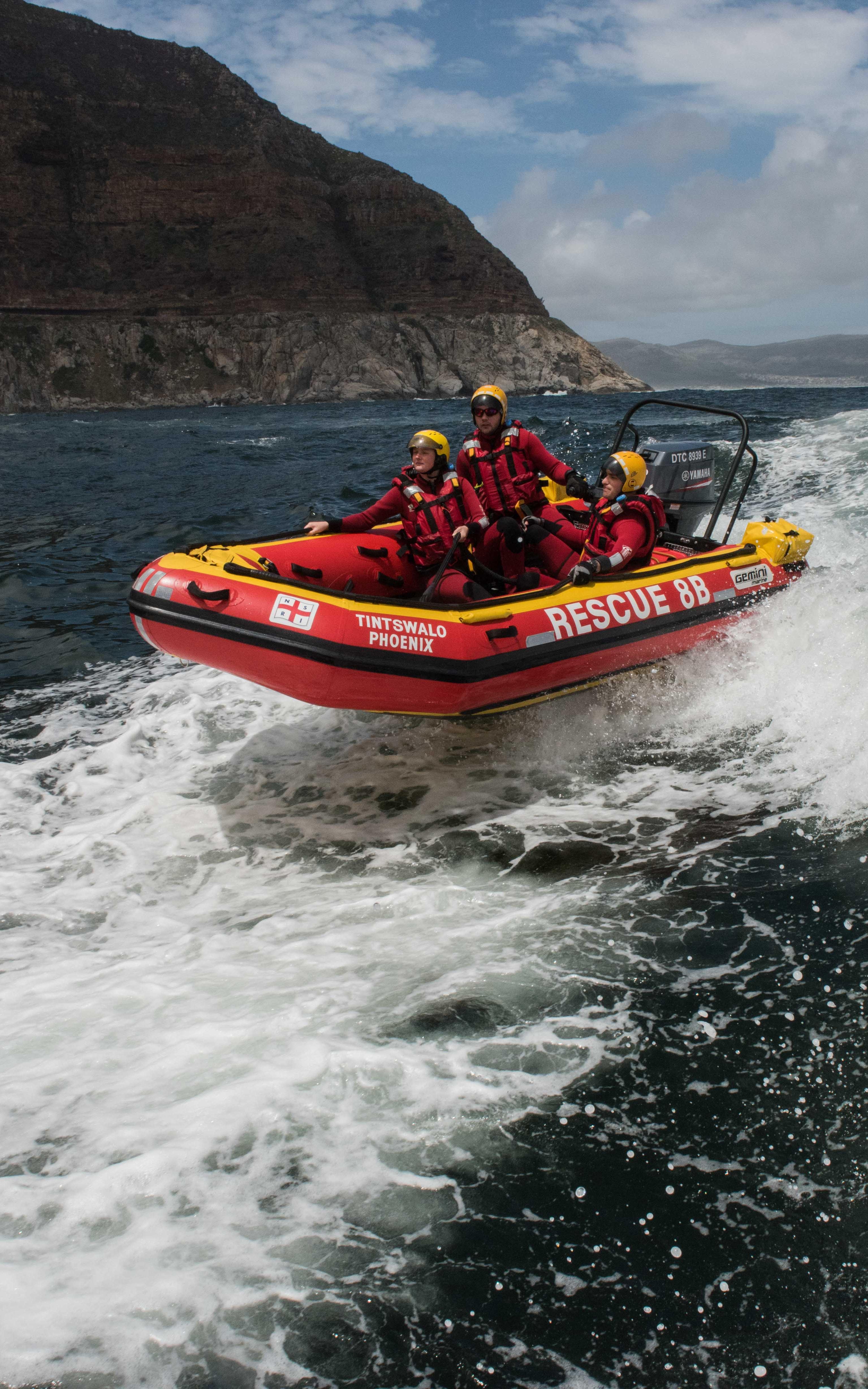 People on a rescue boat in the water