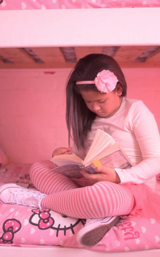 Girl sitting on bed