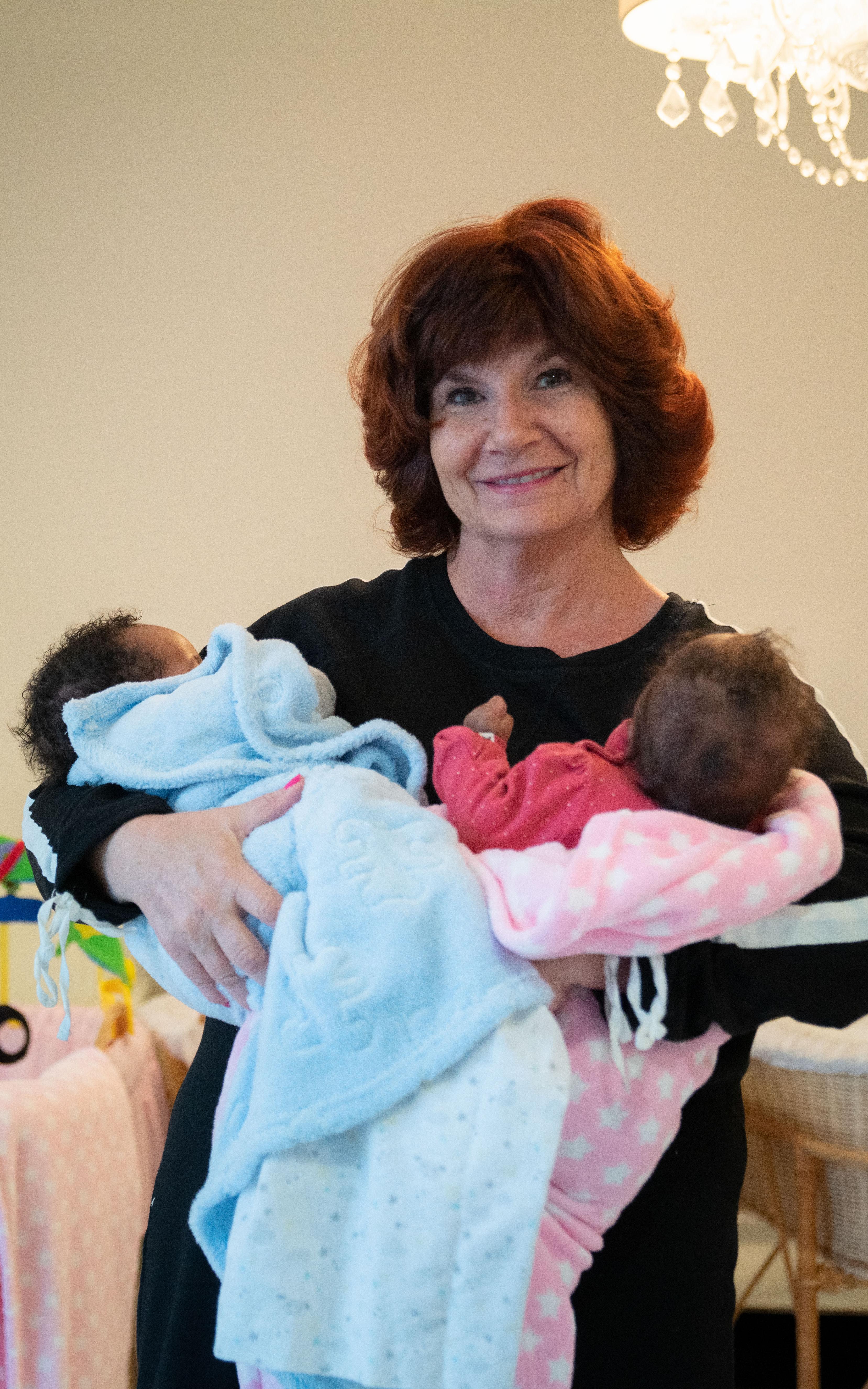 A trained safety mother taking care of abandoned infants.