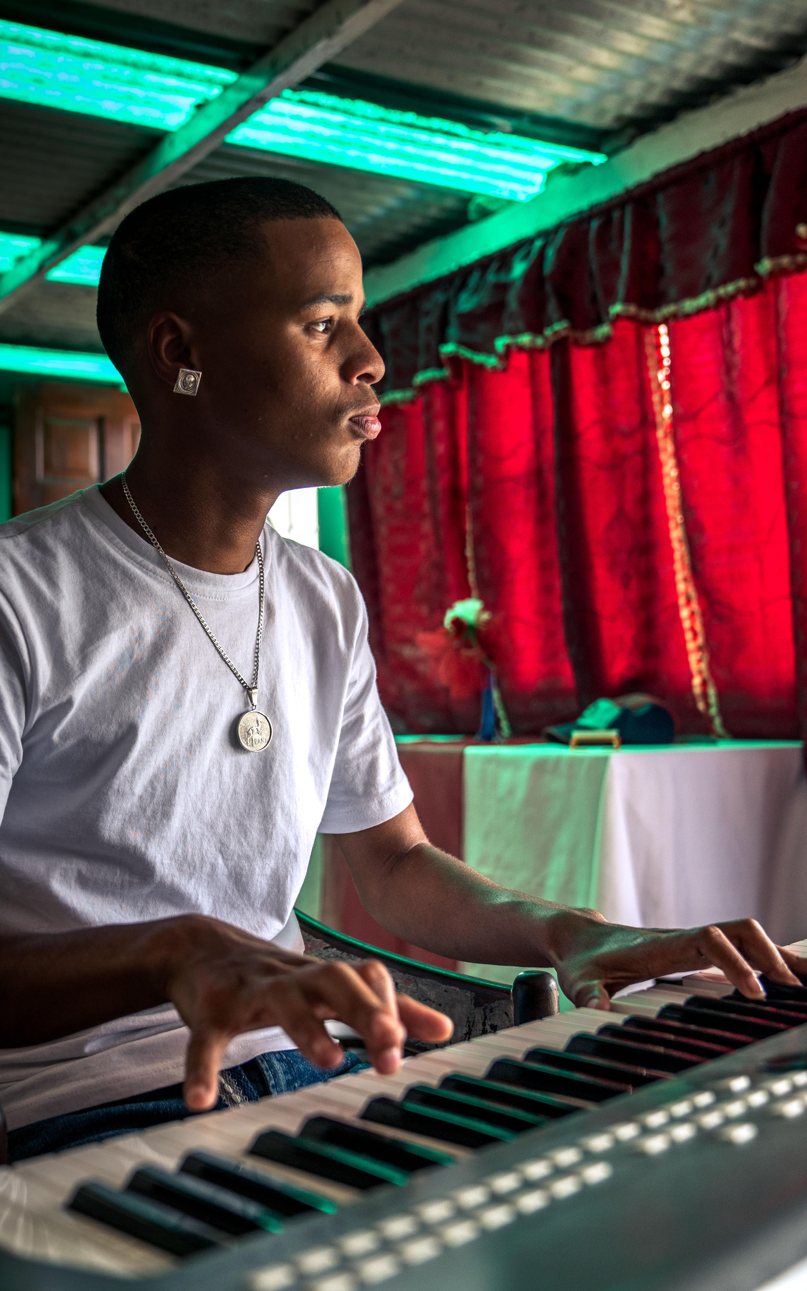 A young man playing the piano