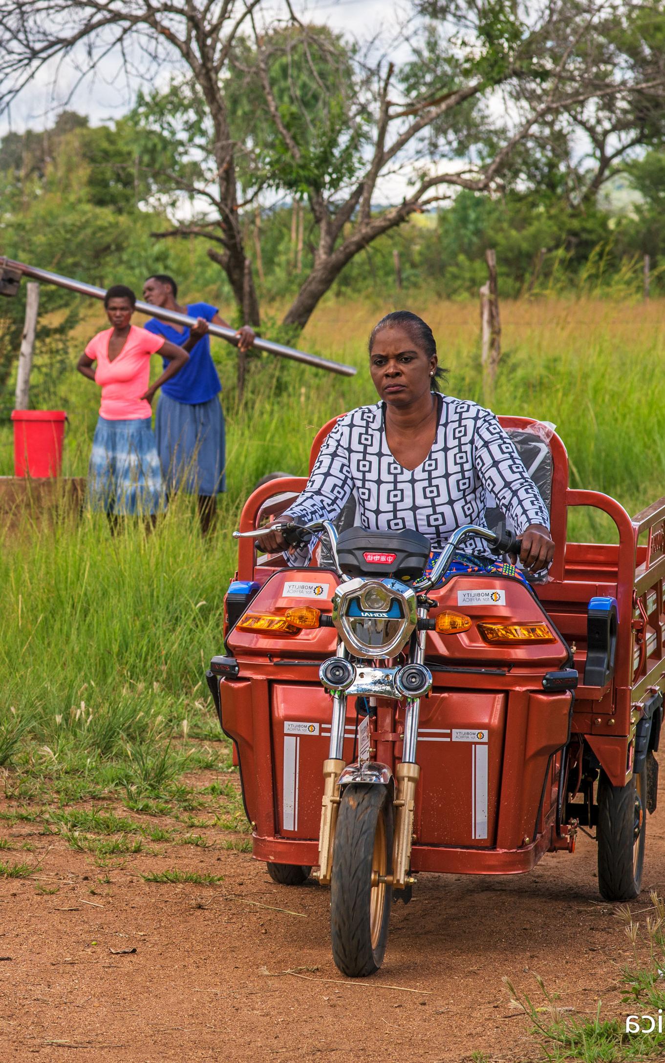 woman in moped. 