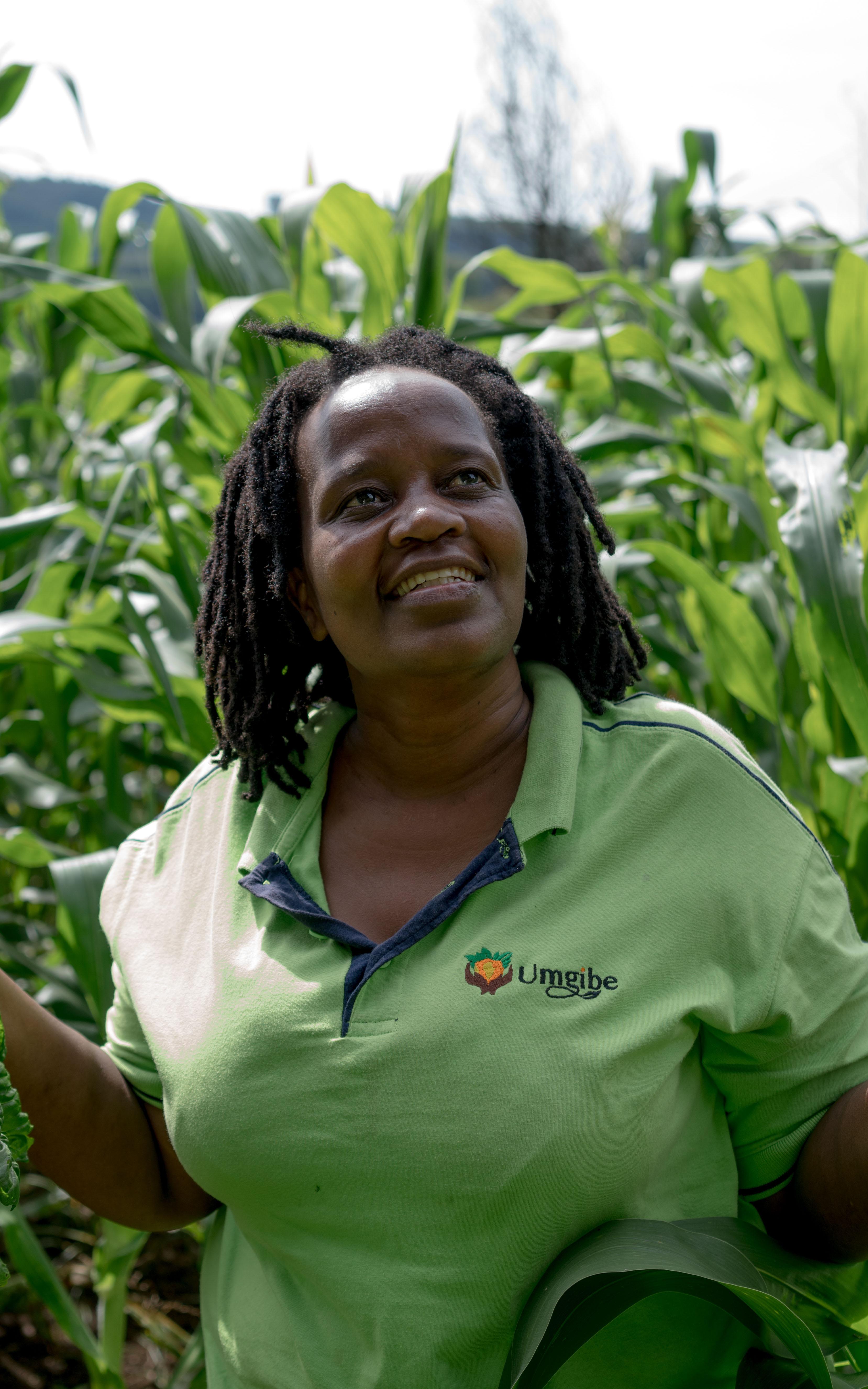 woman smiling in field of crops