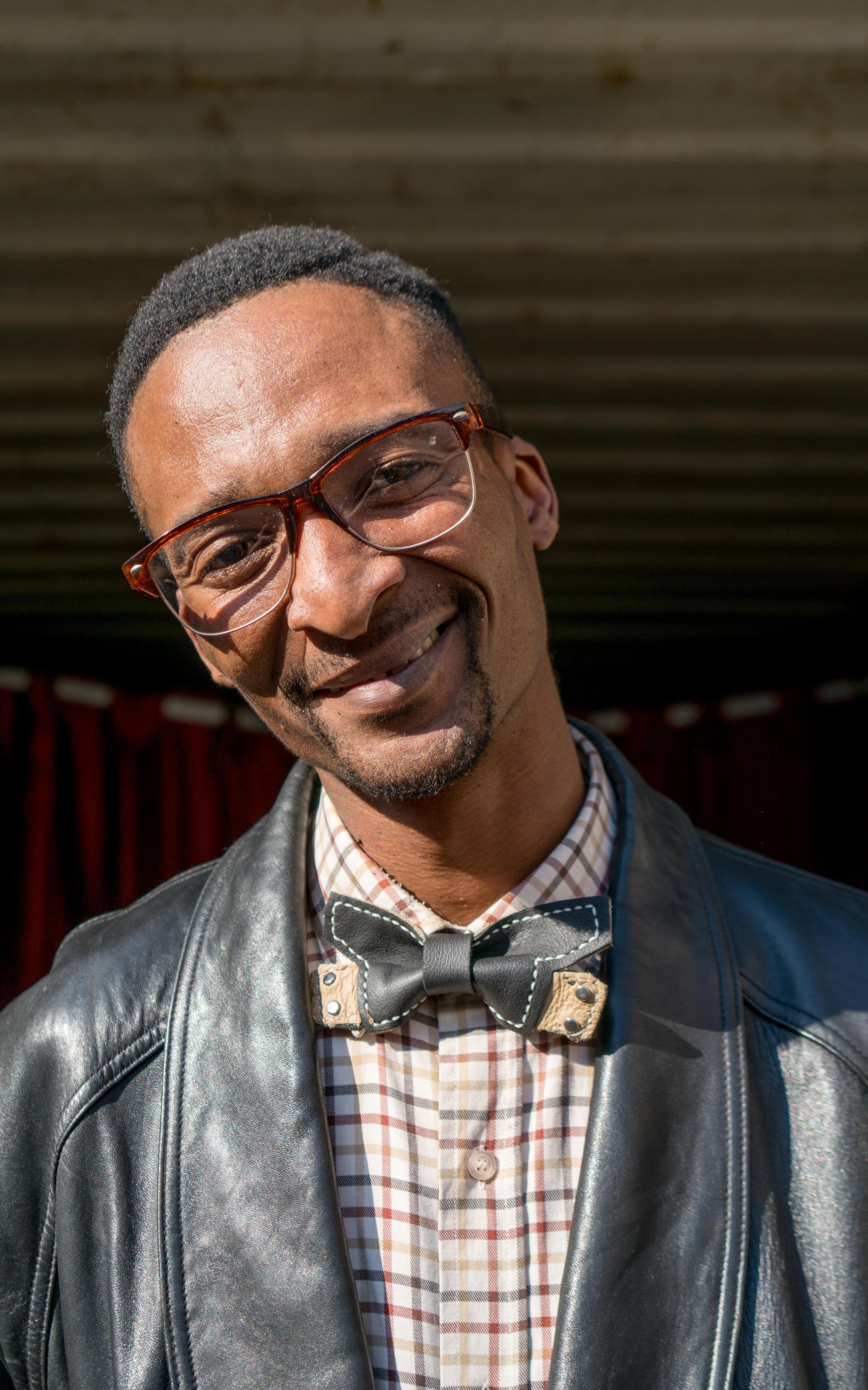 Leather is his fabric. Determination is his thread. This designer’s bowties are badges of hope