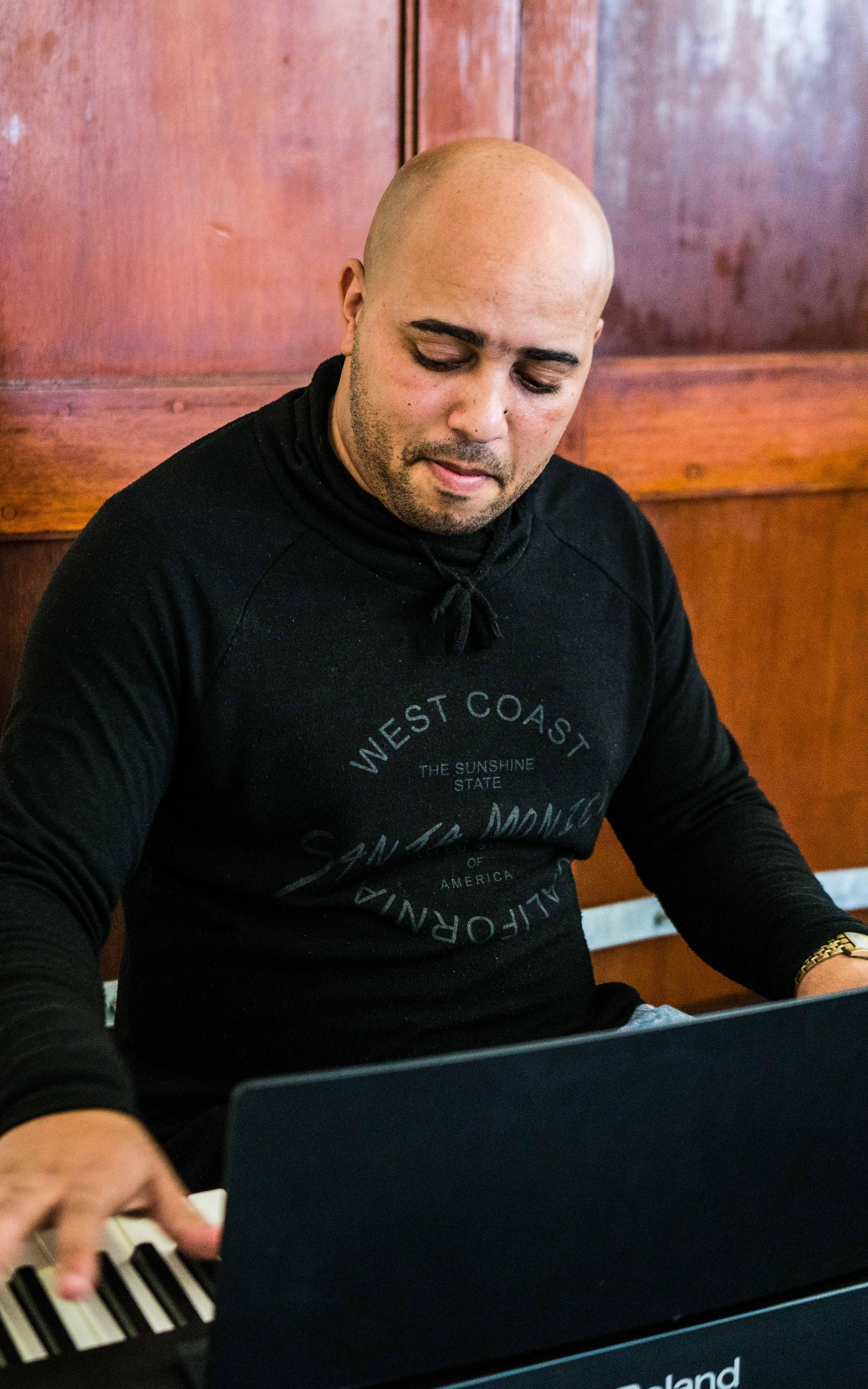 The pianist conducting musical development with scores of positivity in Elsies River