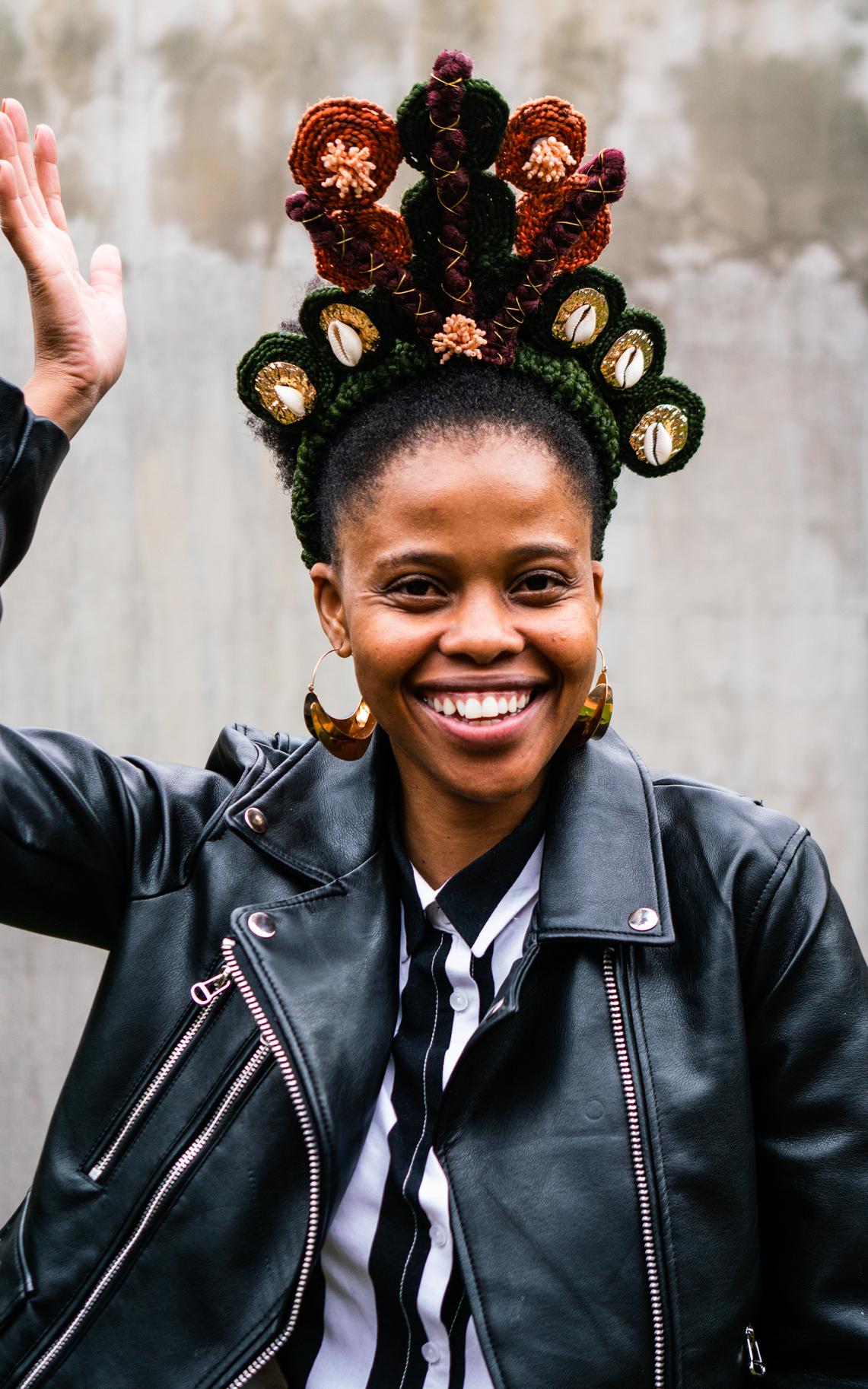 In gravity-defying crowns and sweeping beaded braids, this artist reclaims African hair
