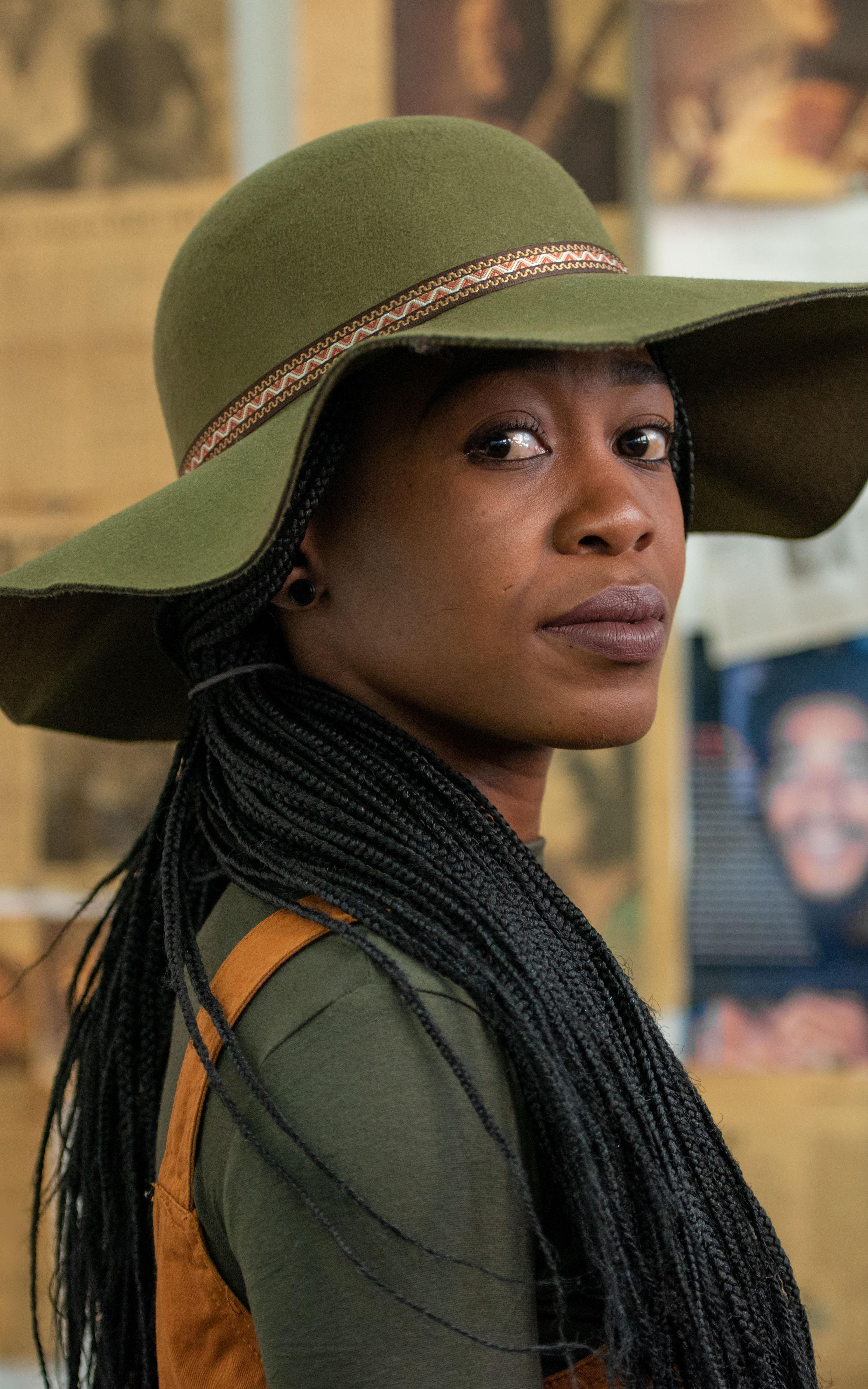 Woman with green wide rim hat