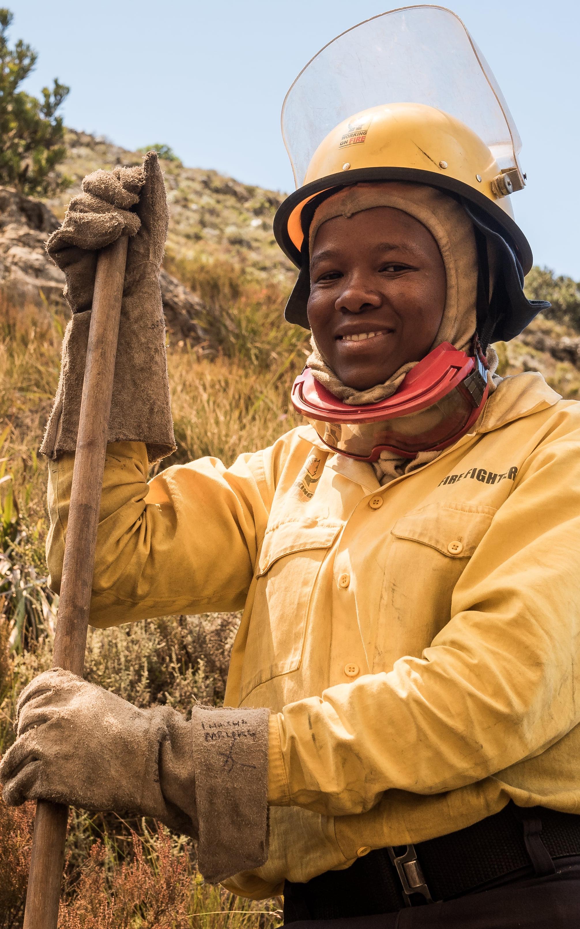 Woman firefighter smiling to camera