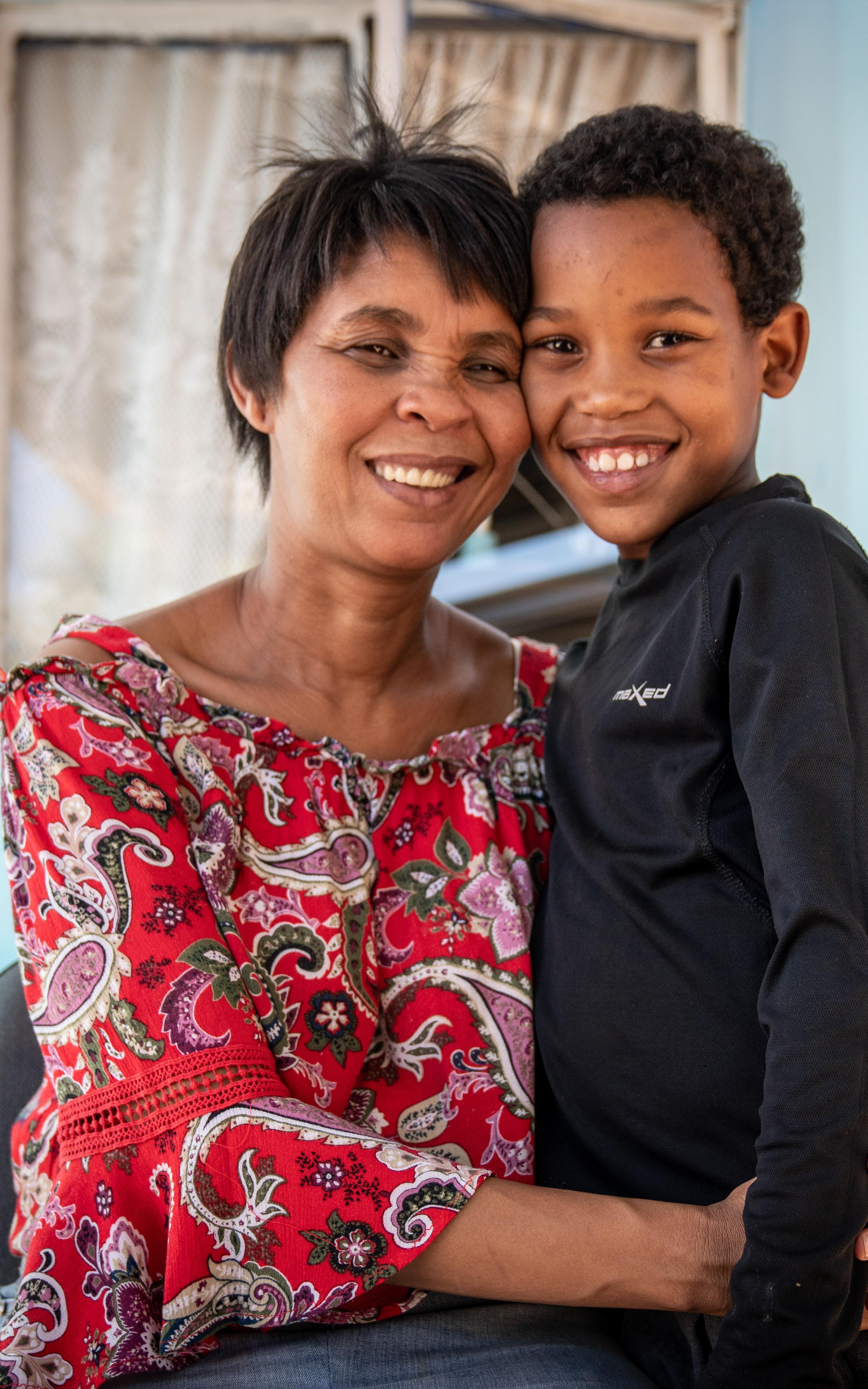 Woman hugging child. 