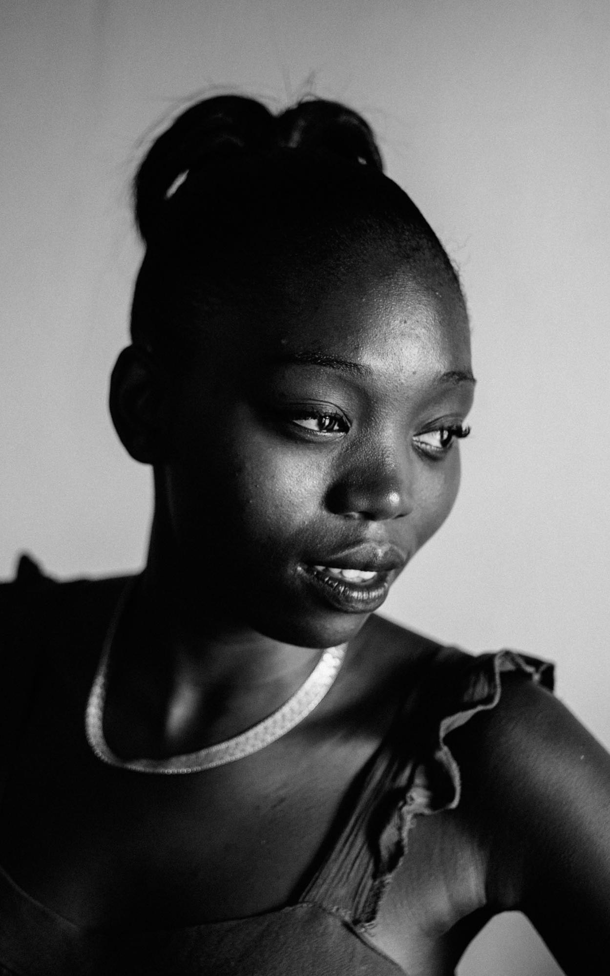 Black girl looking off camera.
