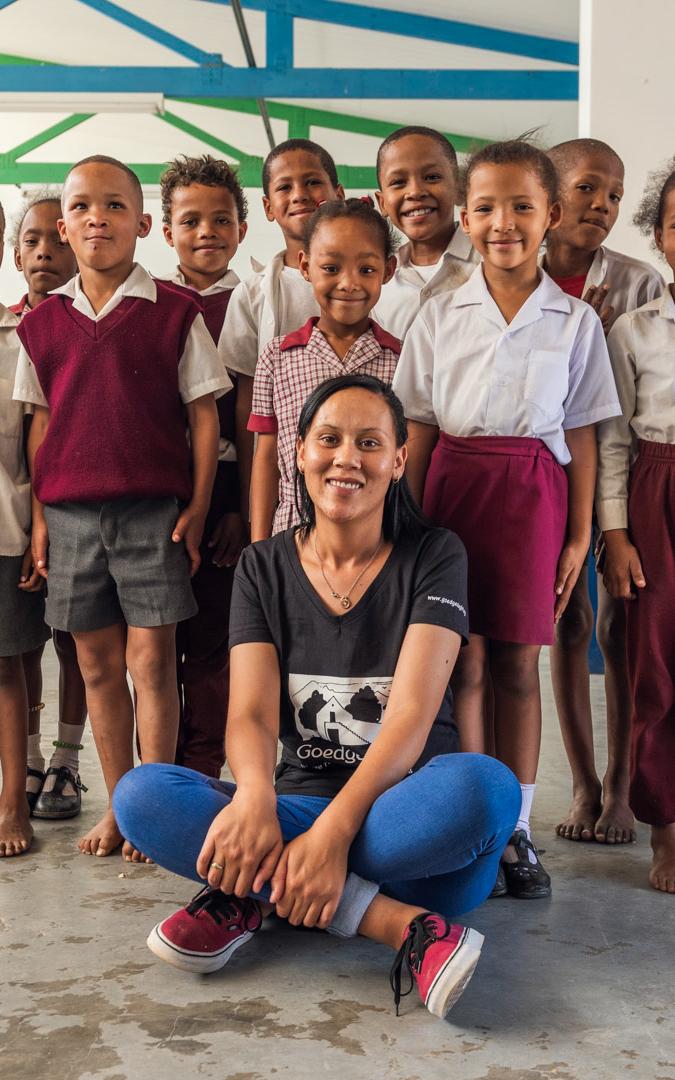 Woman smiling with school children