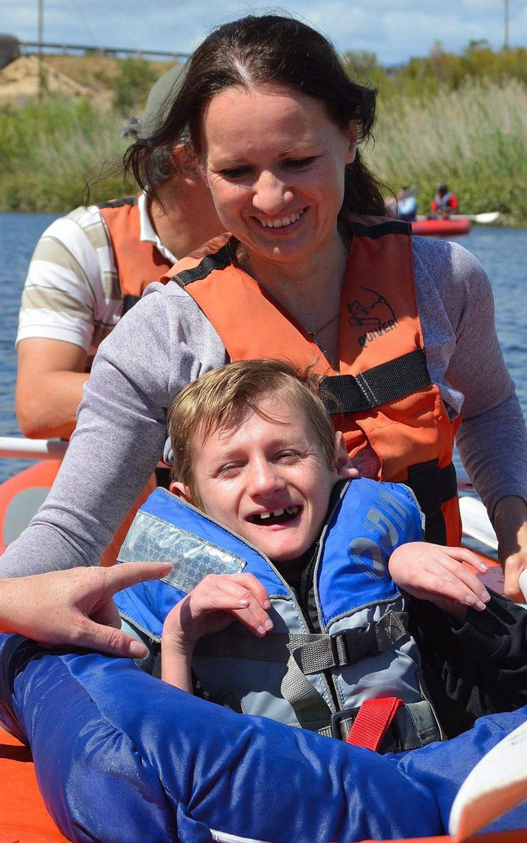 Mother and son in raft.