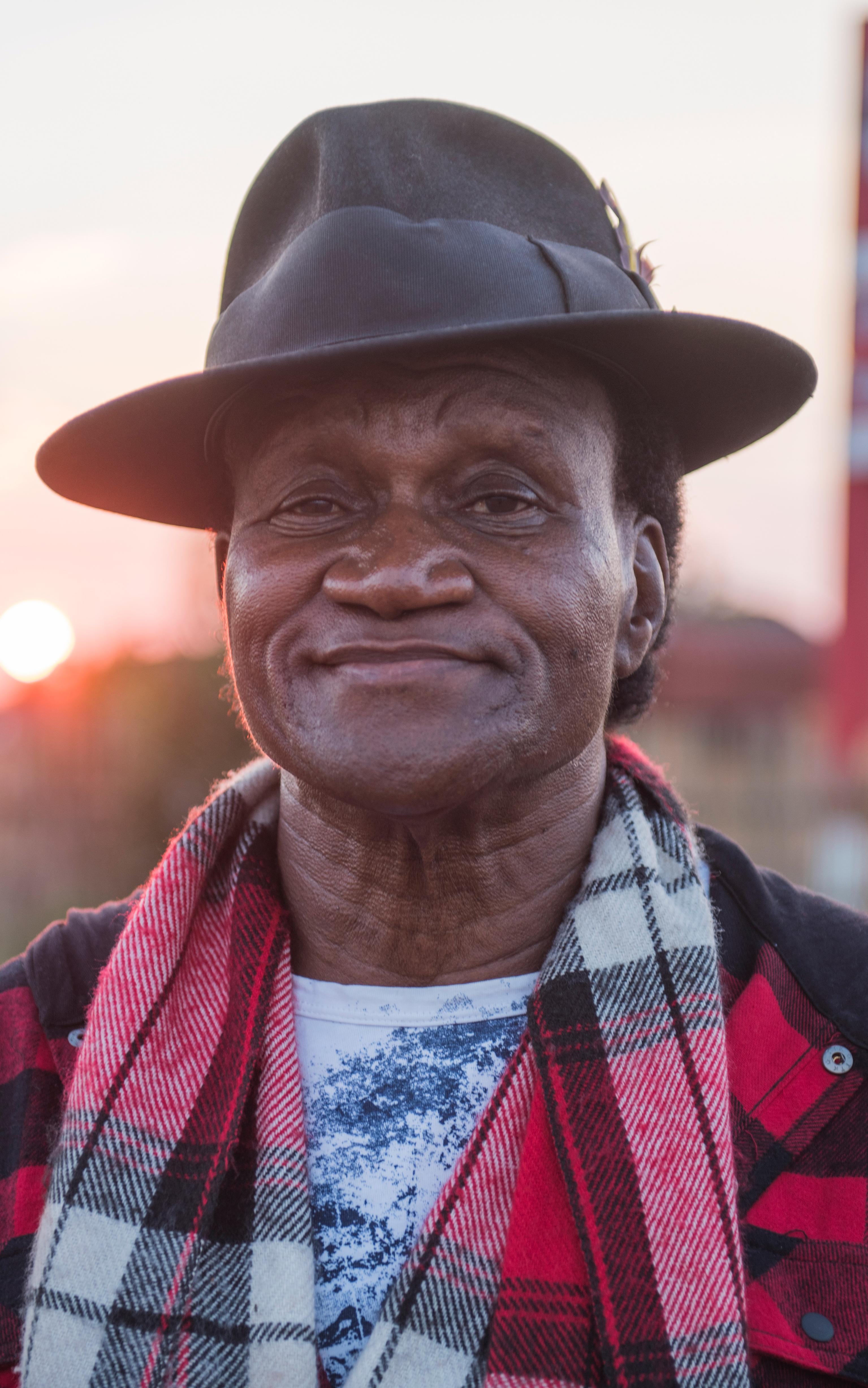 Black man wearing a hat