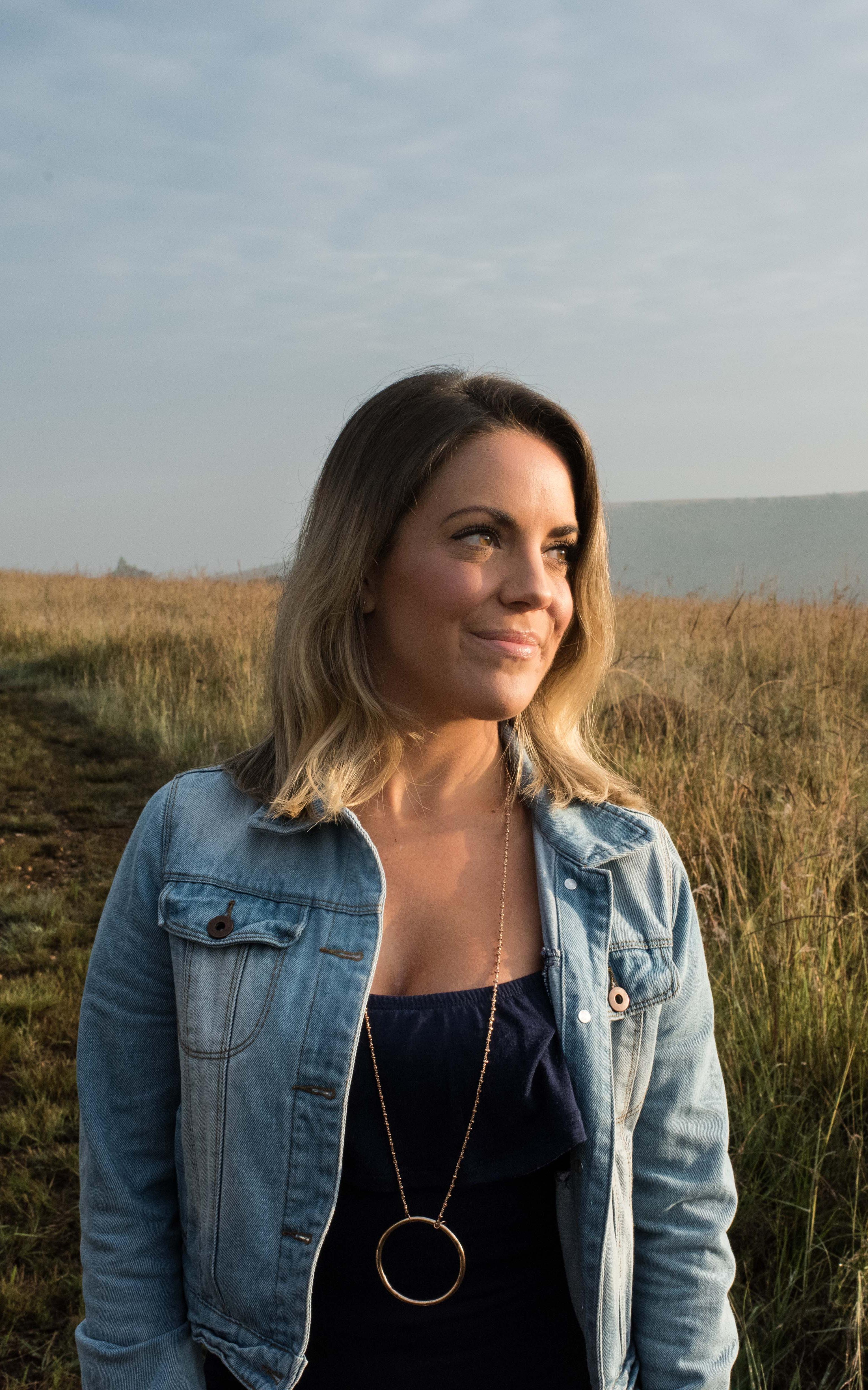 Woman stands in a field