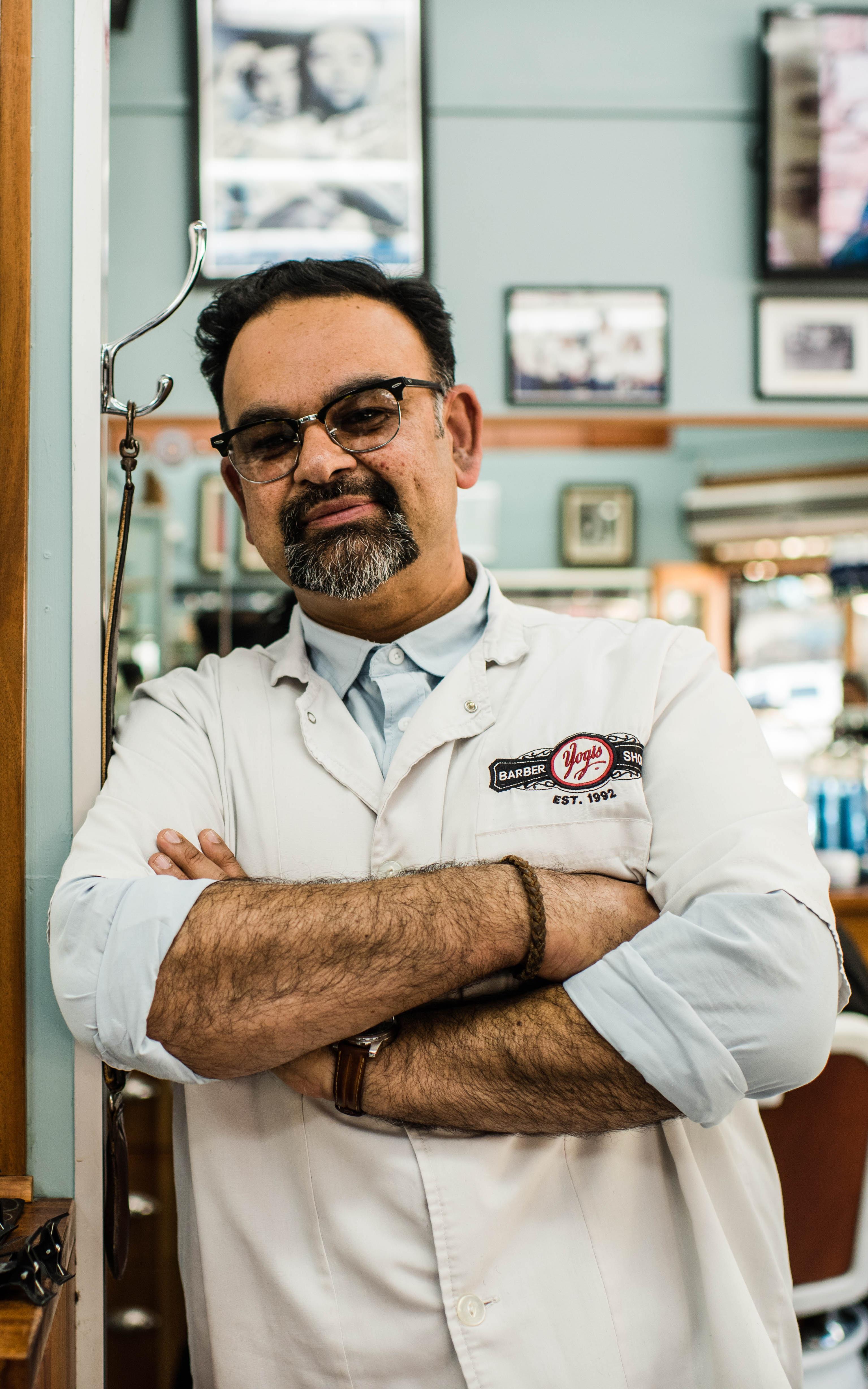 Barber smiling in his shop