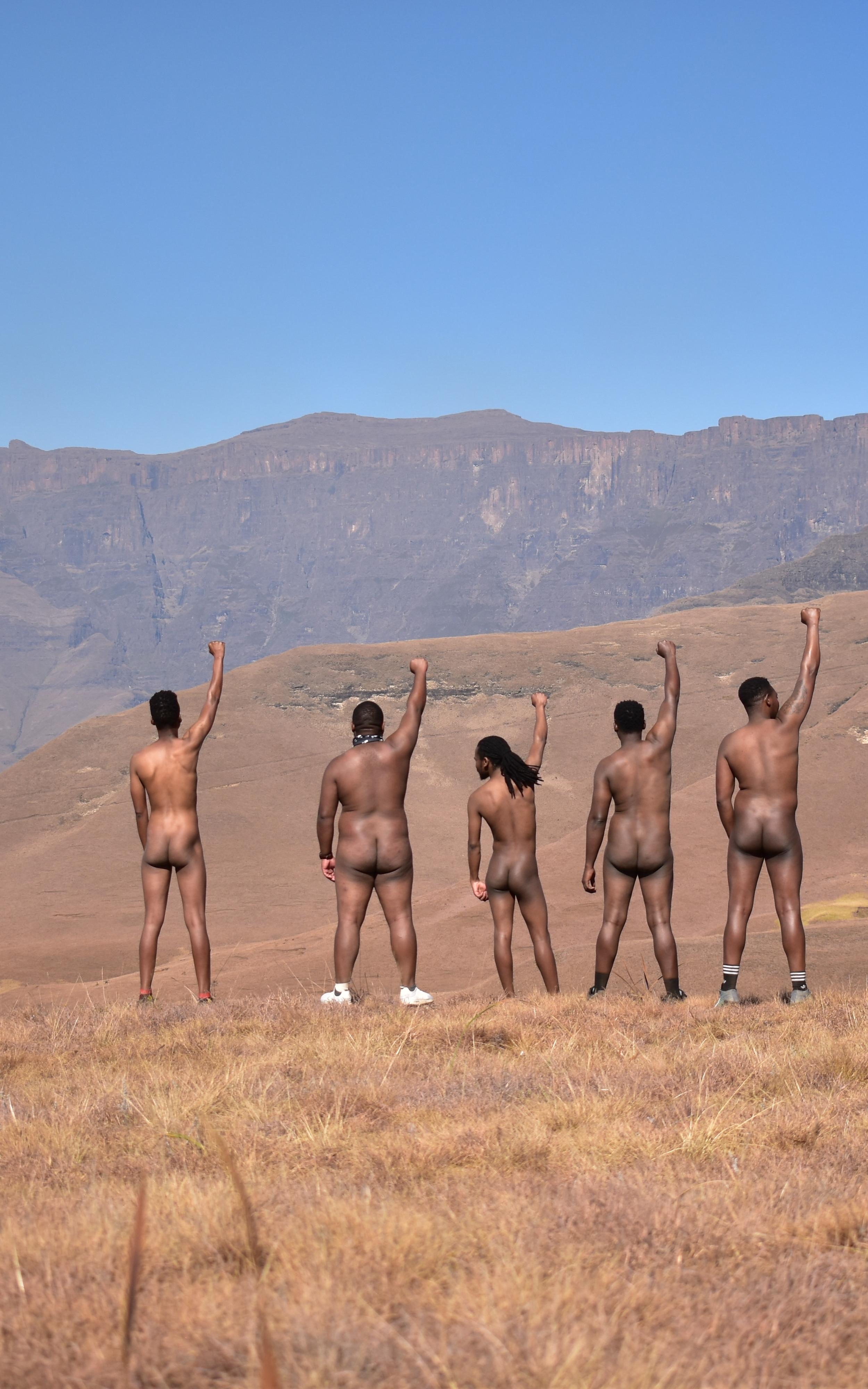 Beautiful News-Nude men on a hike facing away from camera.