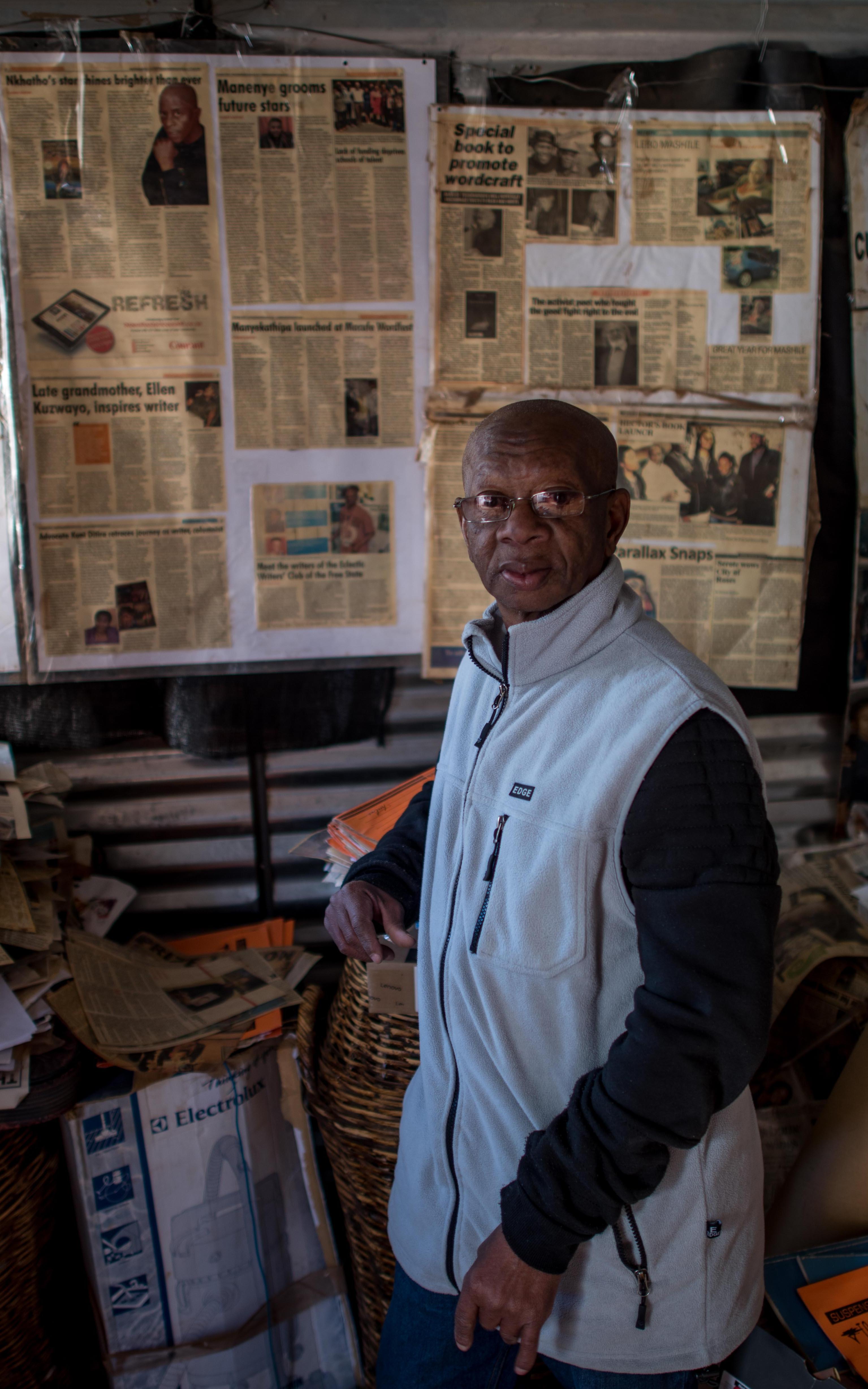 Old Man. Newspapers.