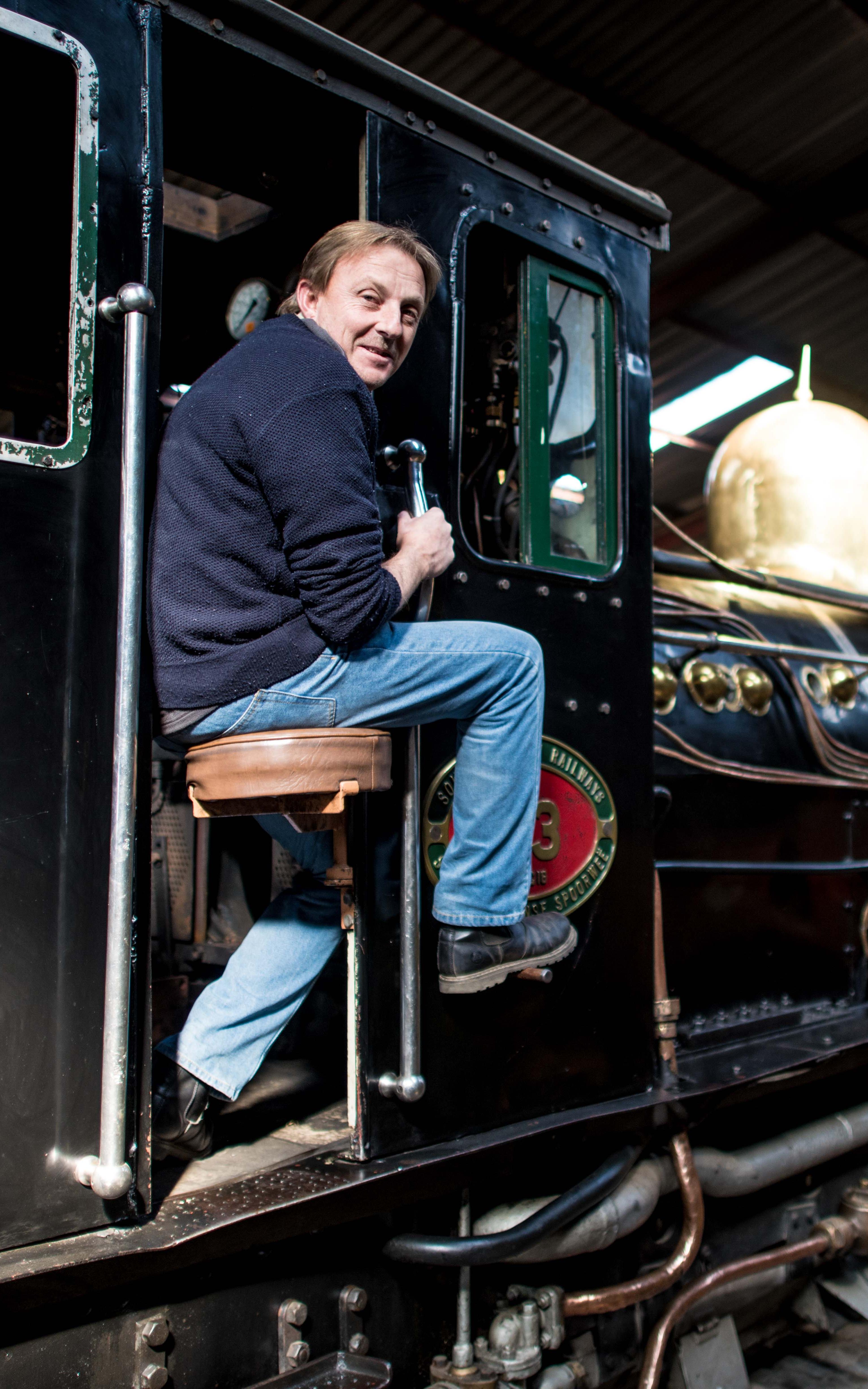 Caucasian man smiling on train