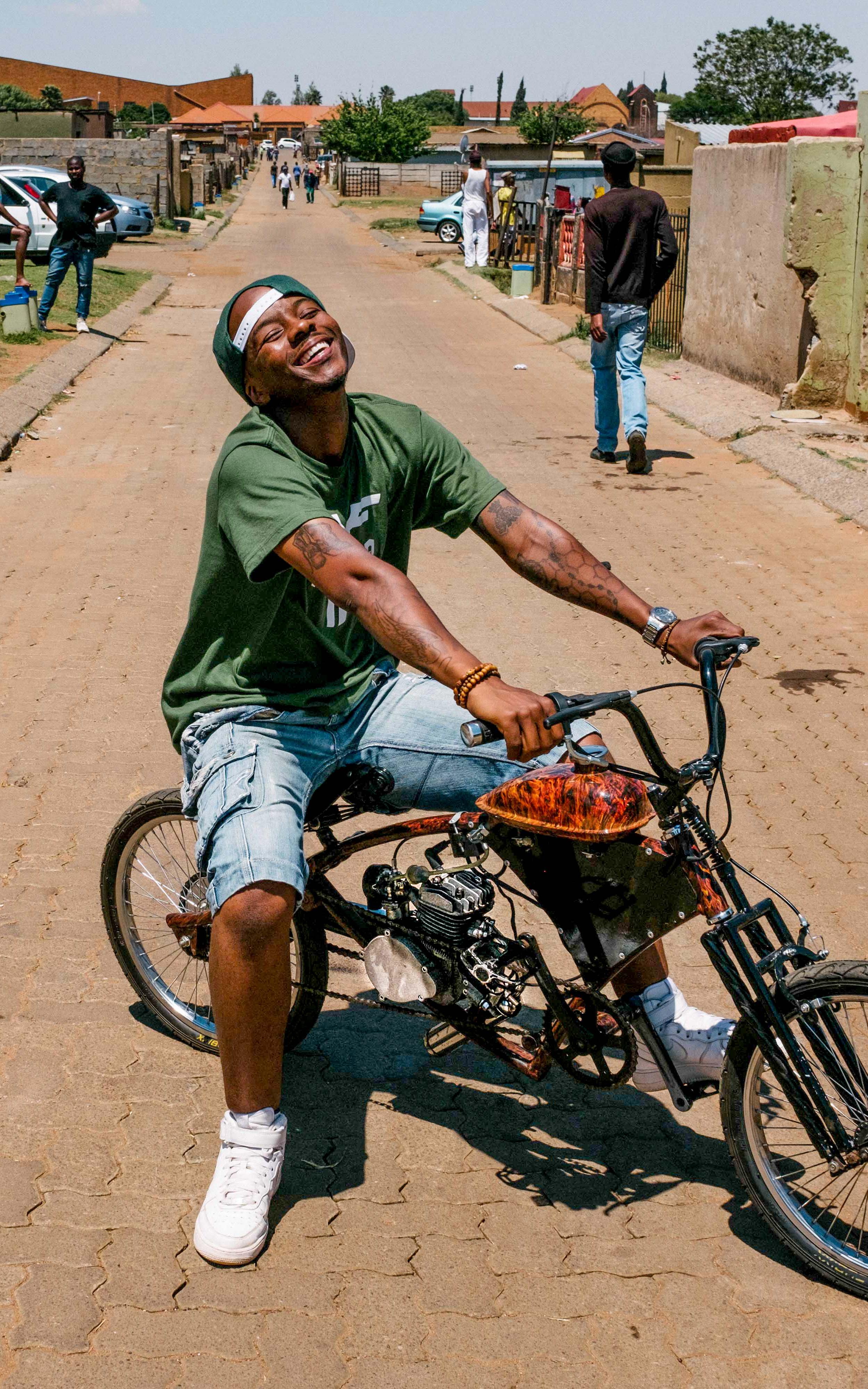 Man on motorised bicycle