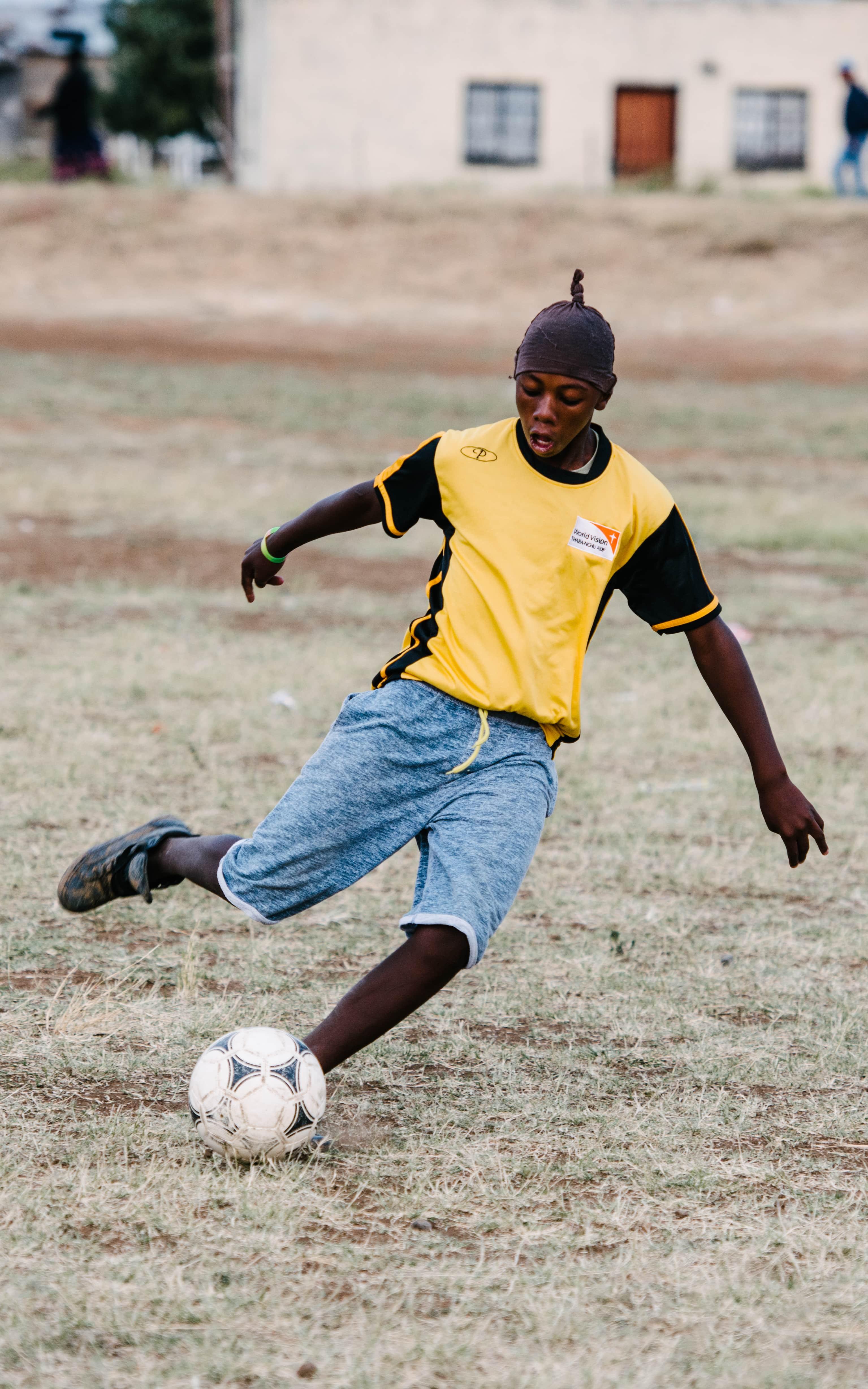 Kid playing soccer