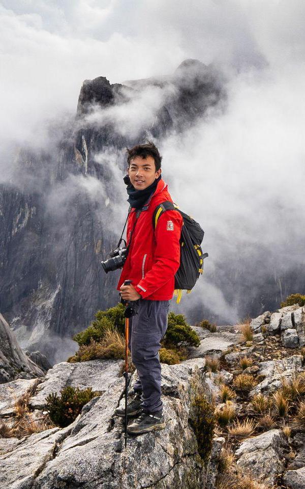 Beautiful News- Young man hiking a mountain range