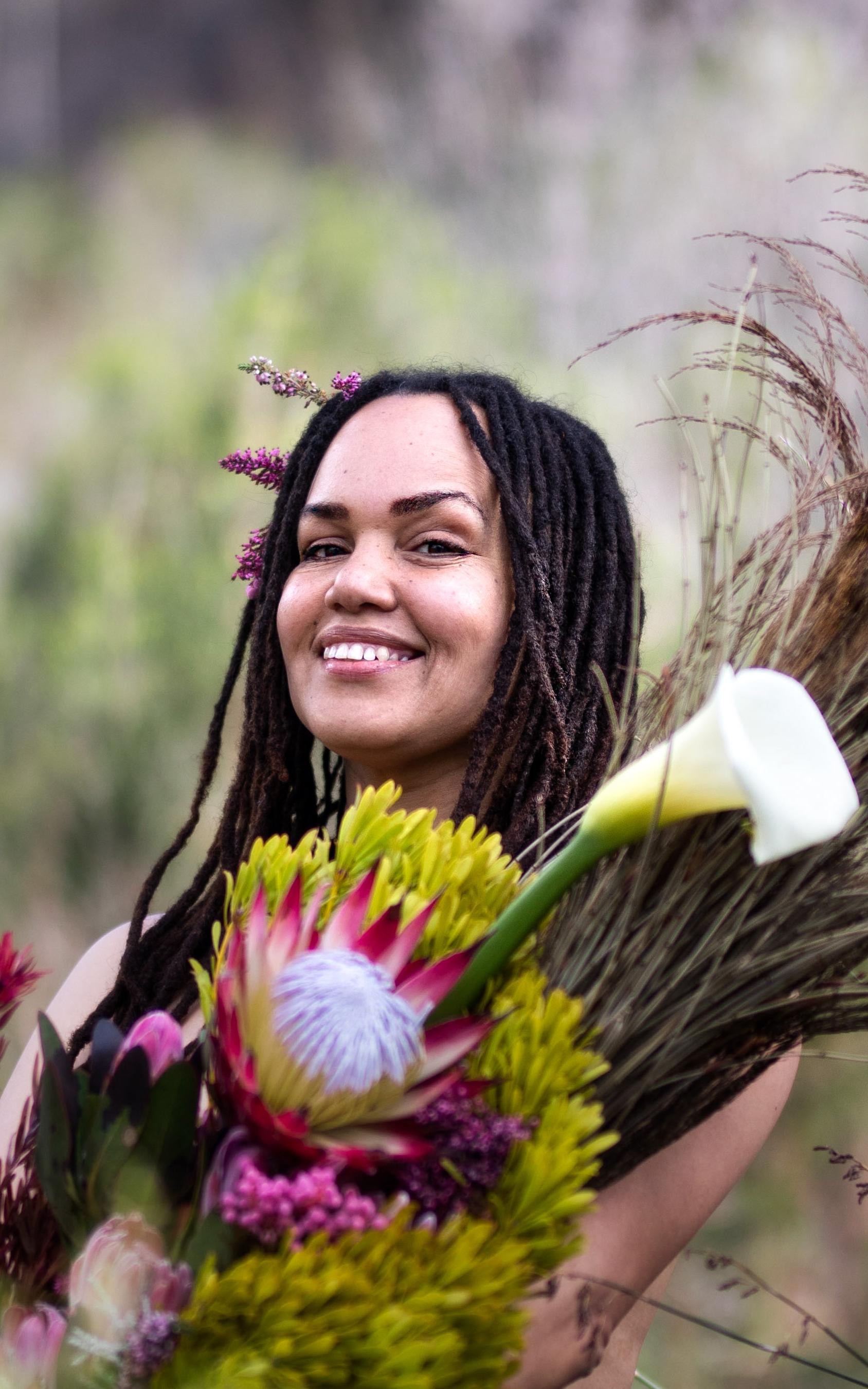 woman posing with flowers