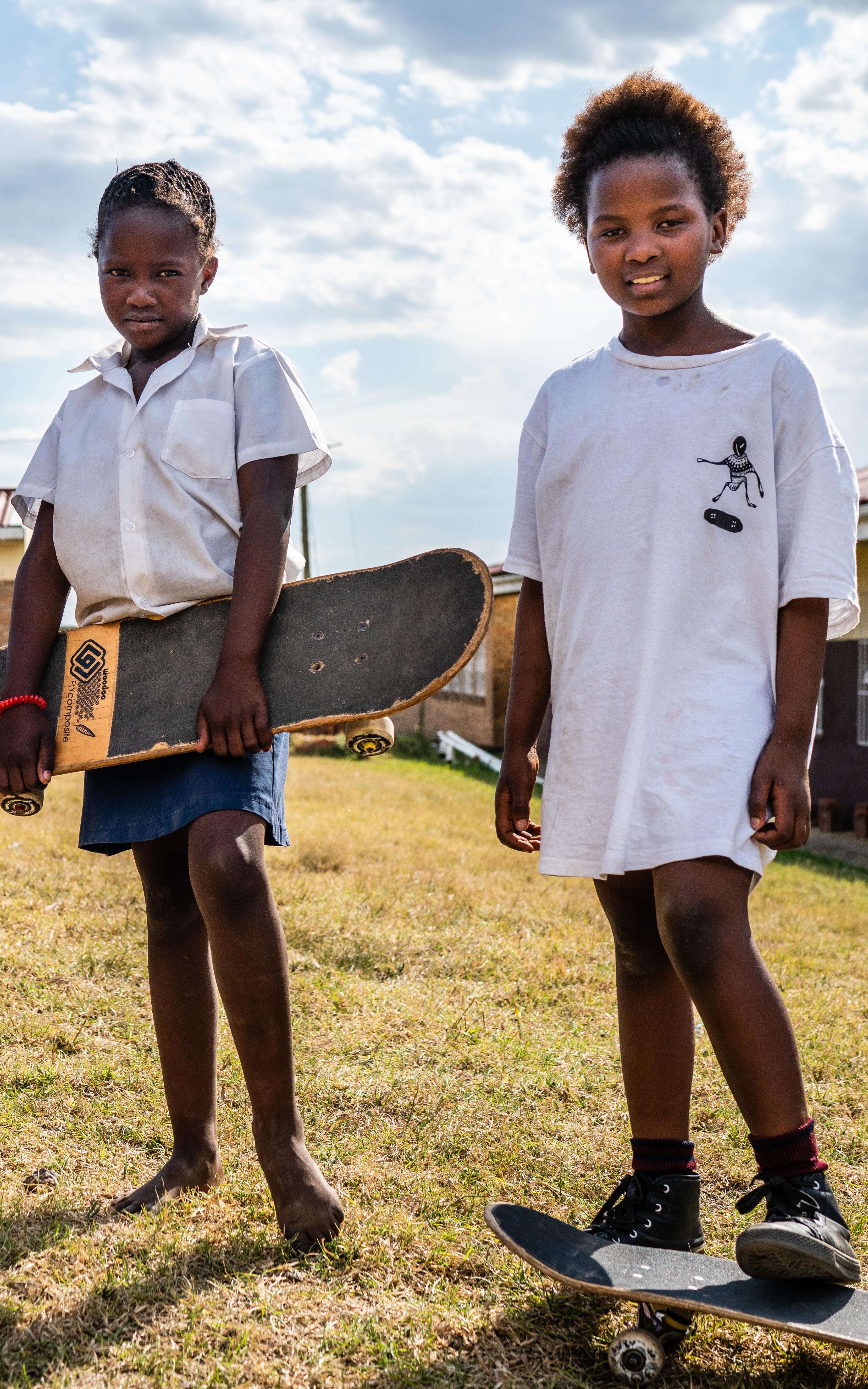 3 female children with skateboards
