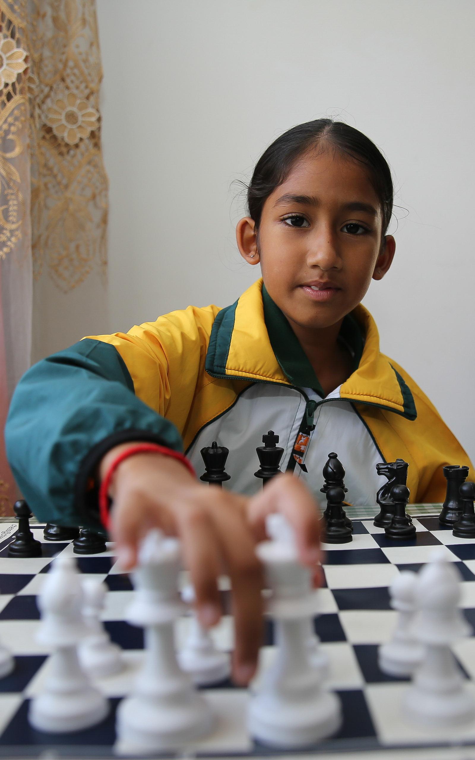 Girl playing chess