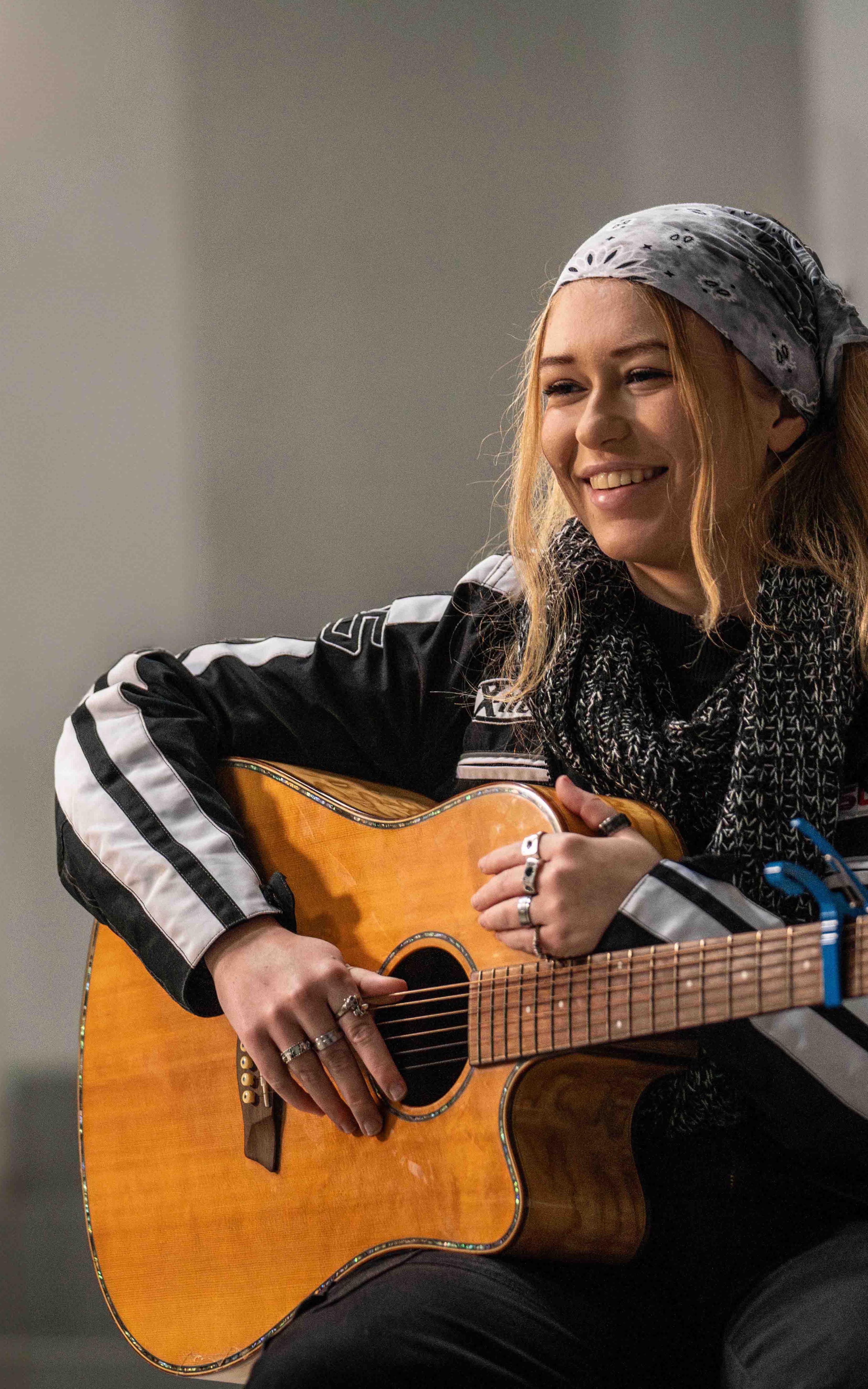 Keely Crockey plays the guitar