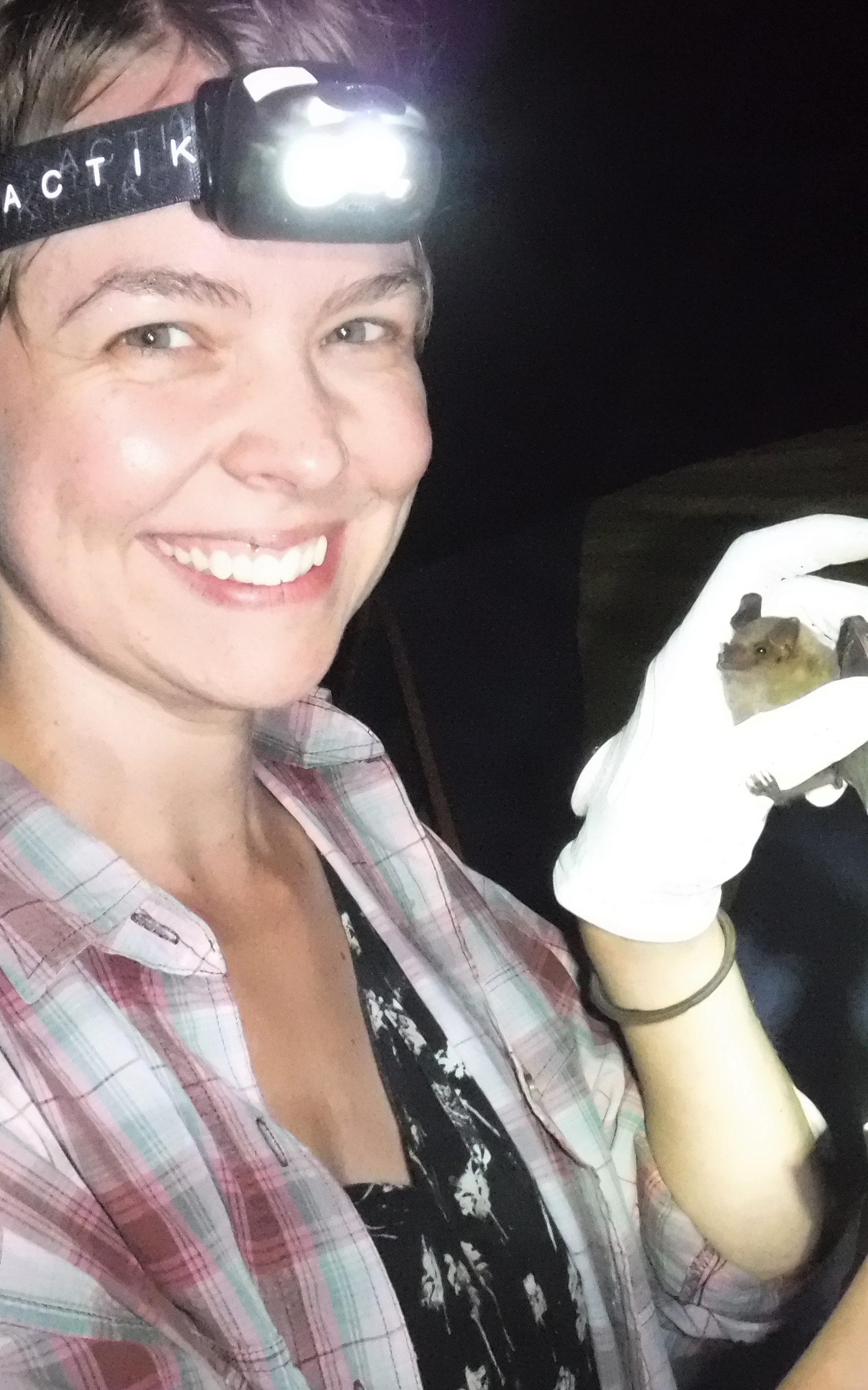 Beautiful News-Woman holding a bat.