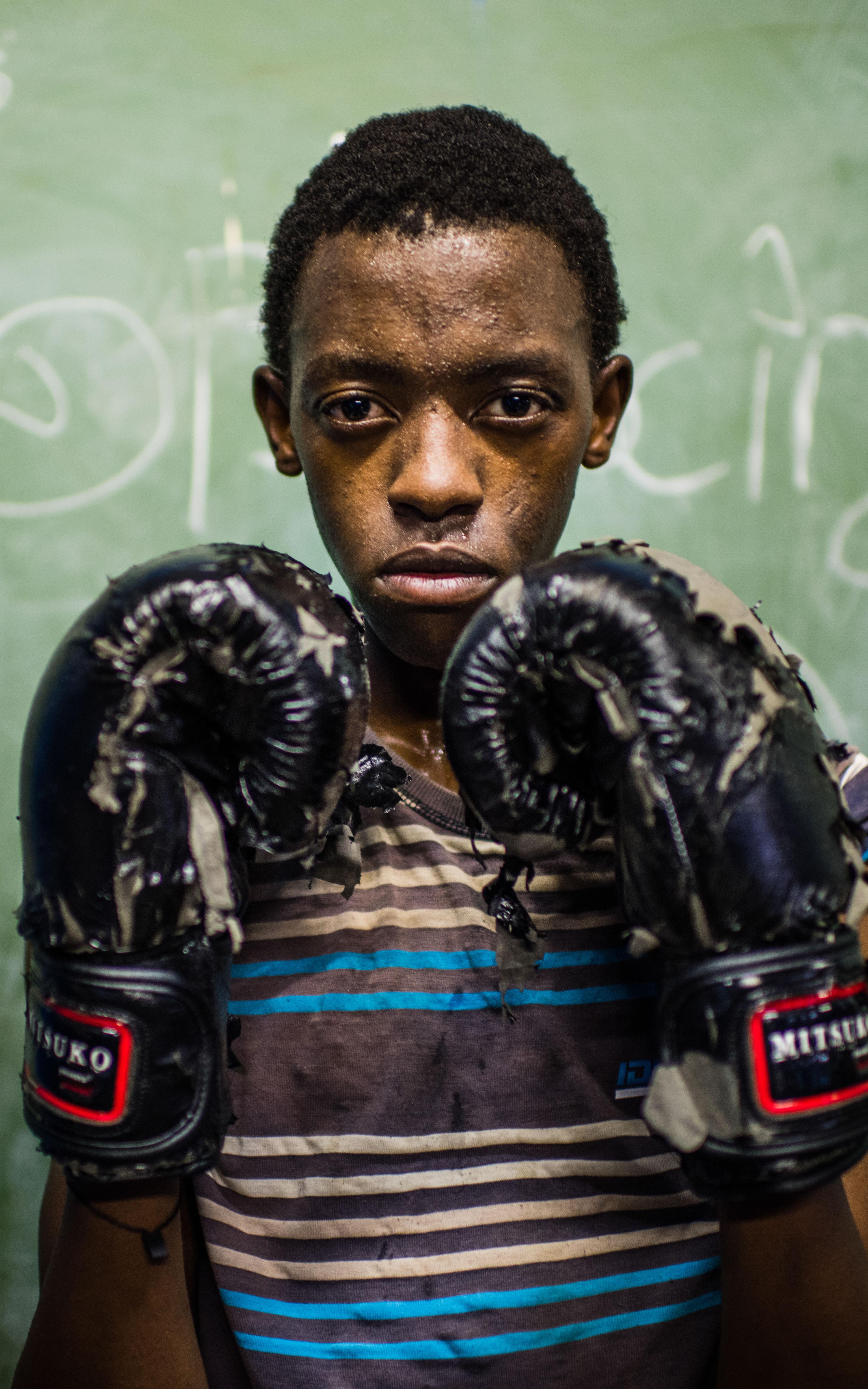 Kid in boxing gear.