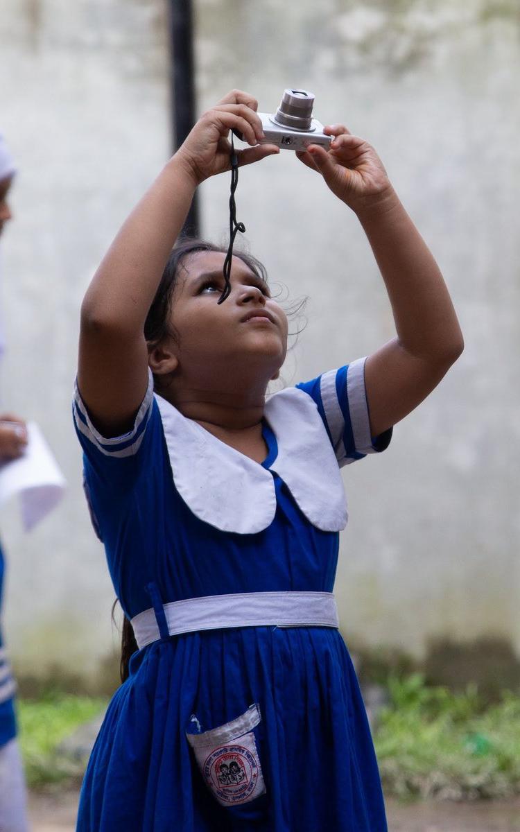 Young girl with camera.