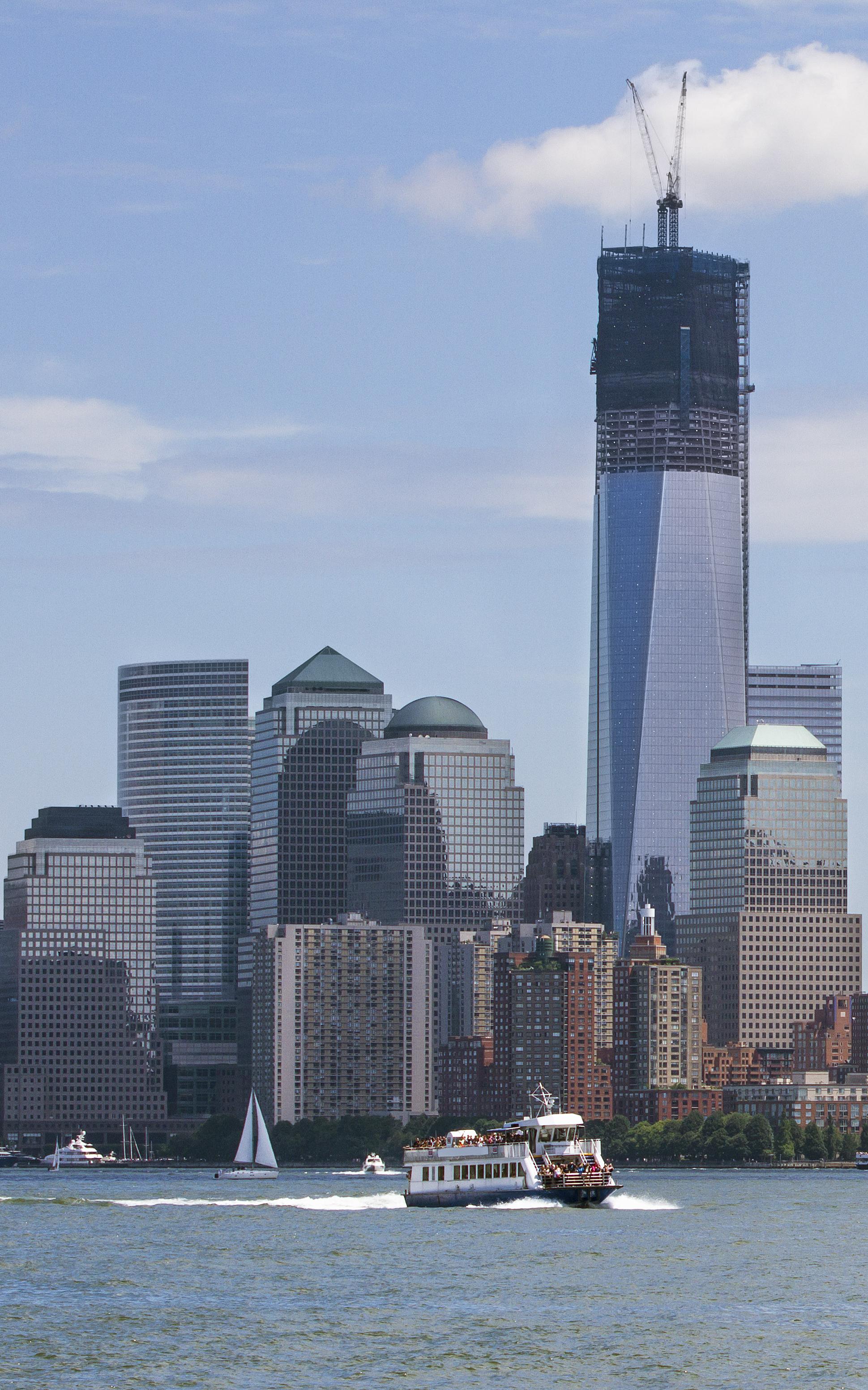 Beautiful News - Distant shot over water of New York skyscraper skyline