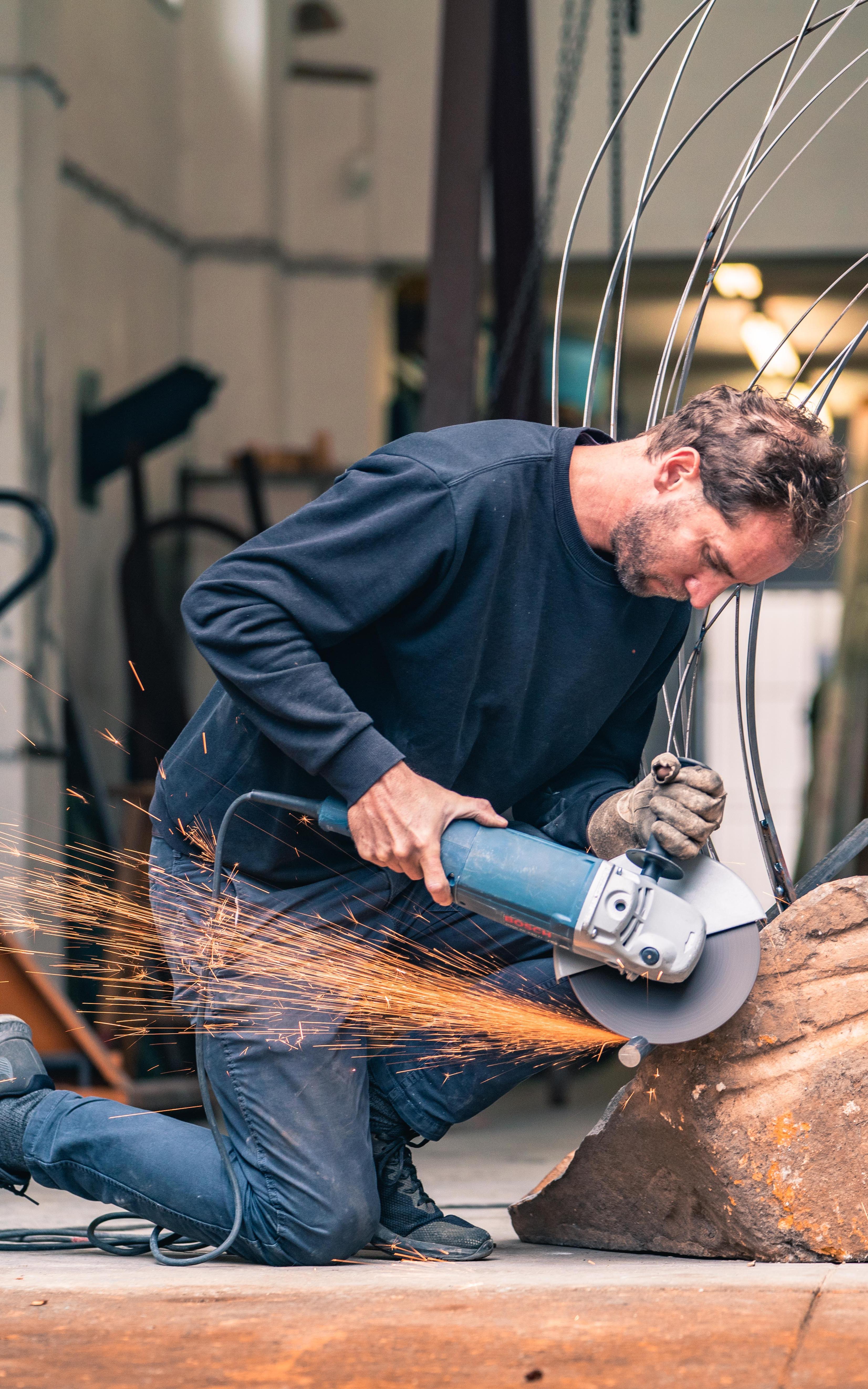 Man shaping rocks. 