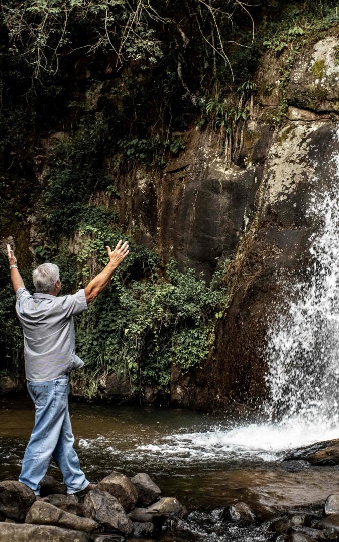 Man at waterfall