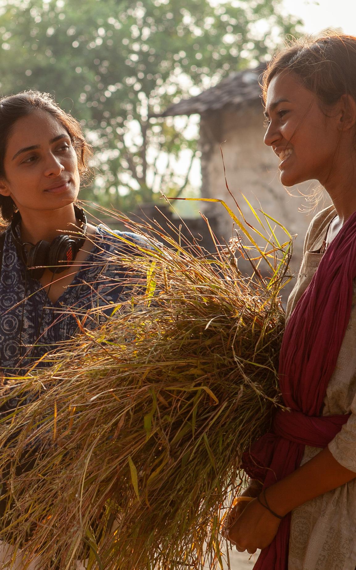 Beautiful News-Two women on a film set.
