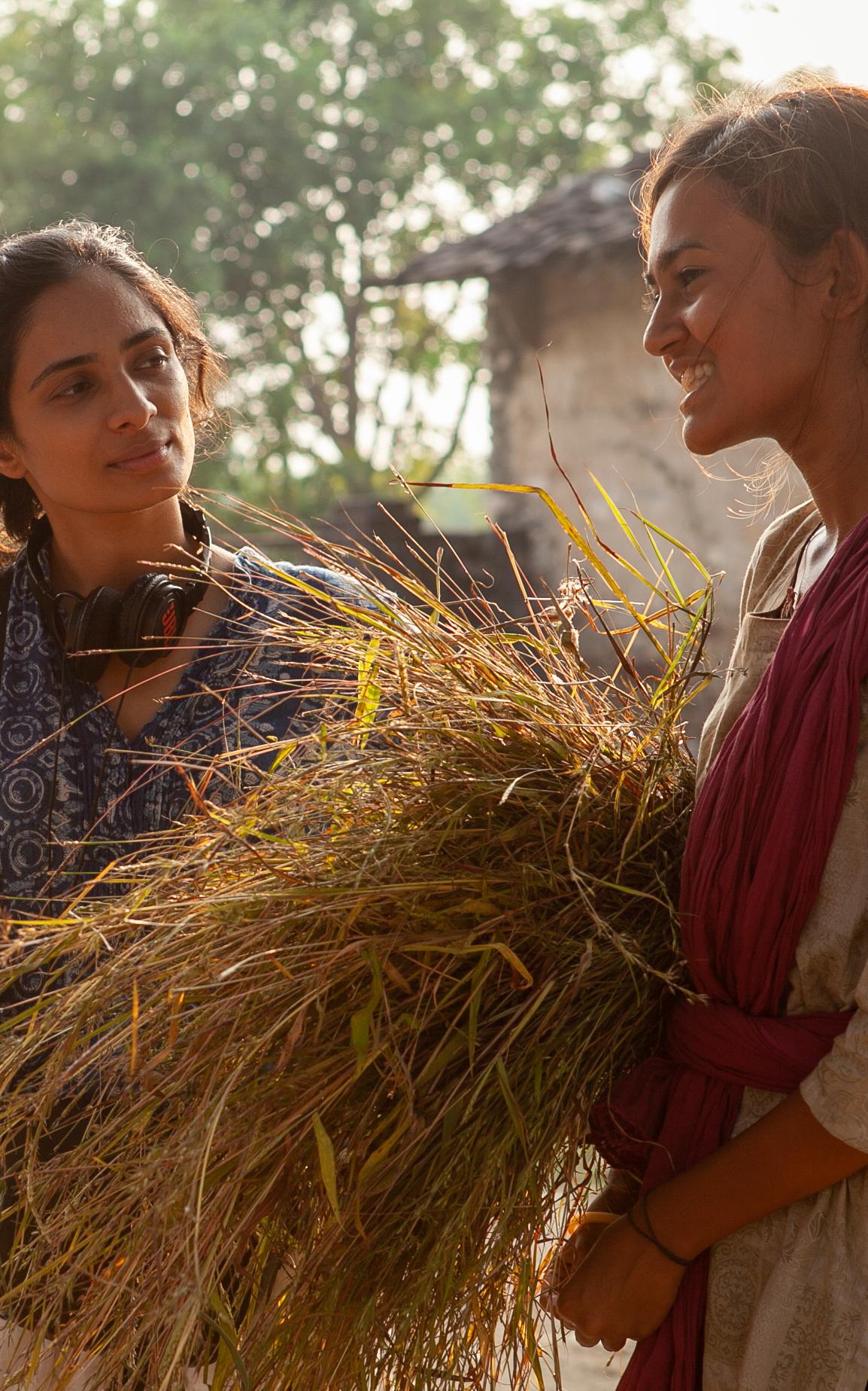 Beautiful News-Two women on a film set.