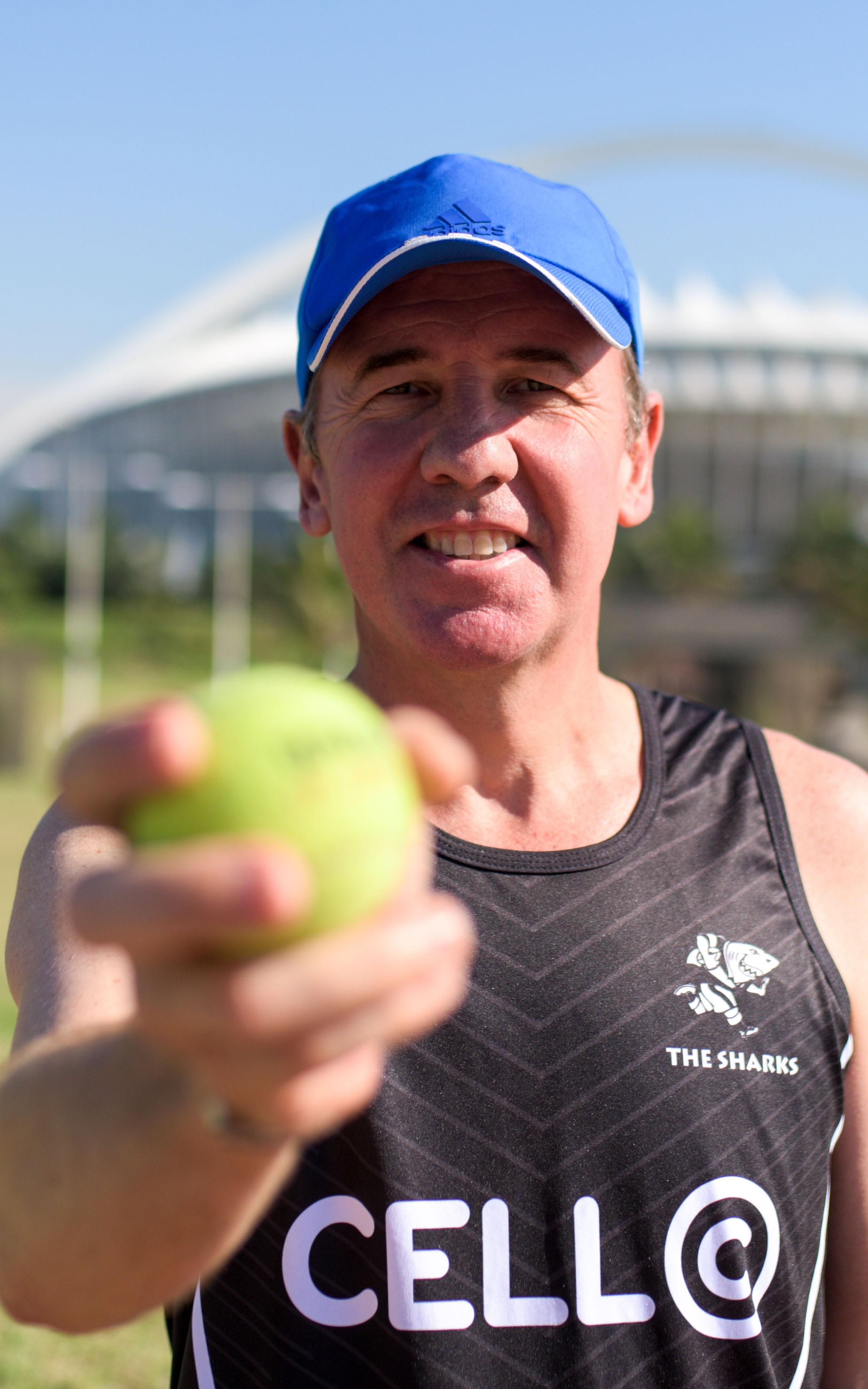 Man Holding Ball.