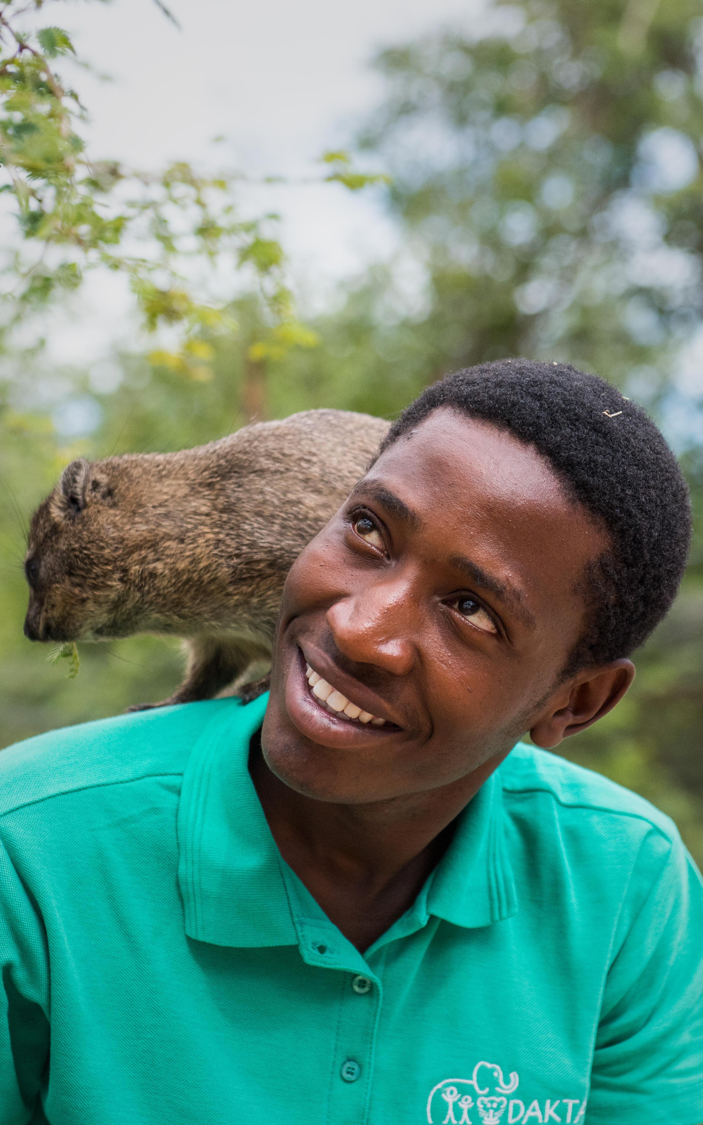 Smiling man with dassie on his shoulder