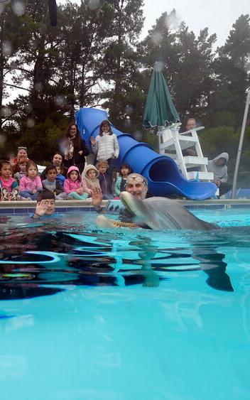 Beautiful News - Roger Holzberg of Edge Innovations in a swimming pool with a robot dolphin 