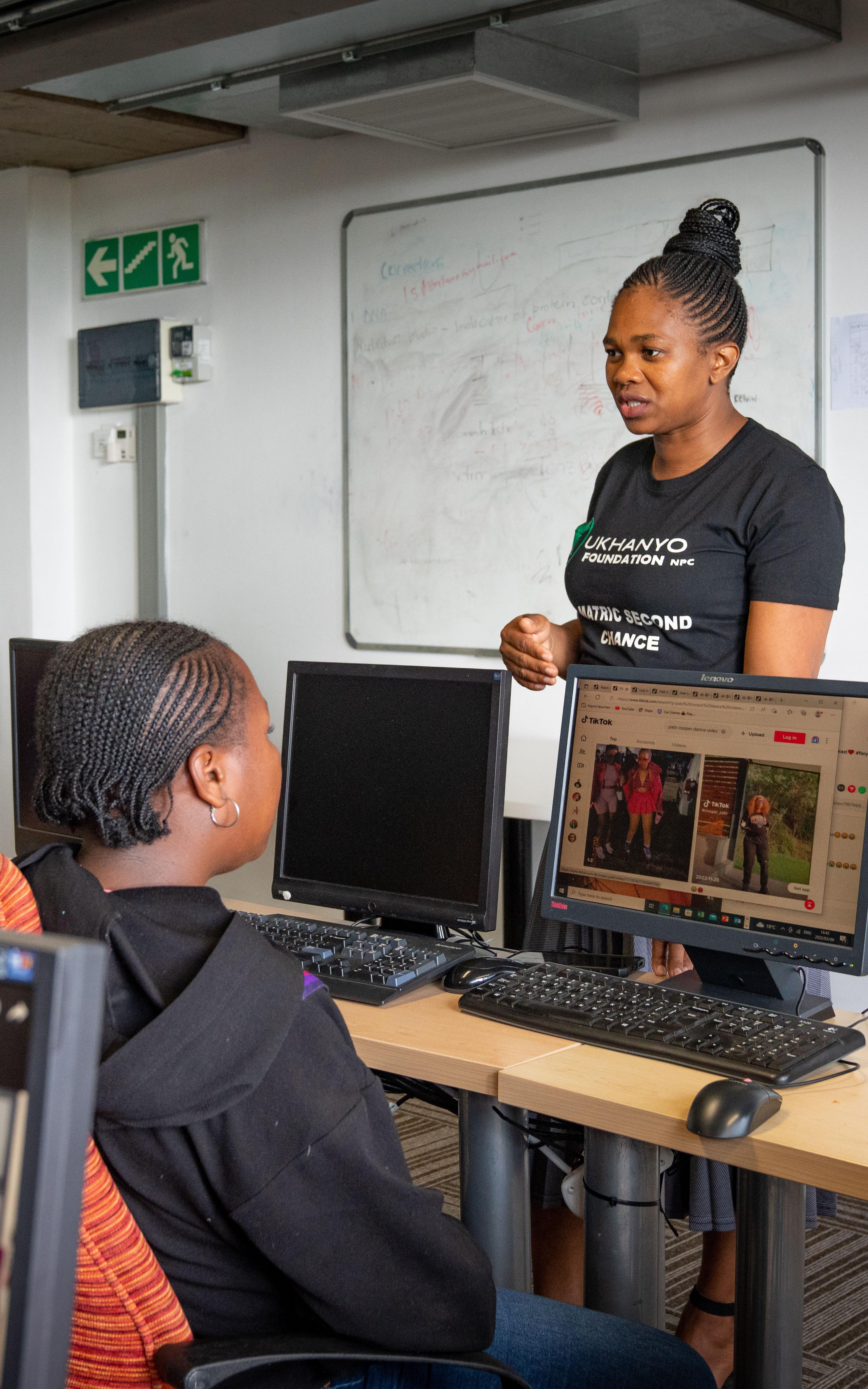 Sandi Gwele of Ukhanyo Foundation talks to students