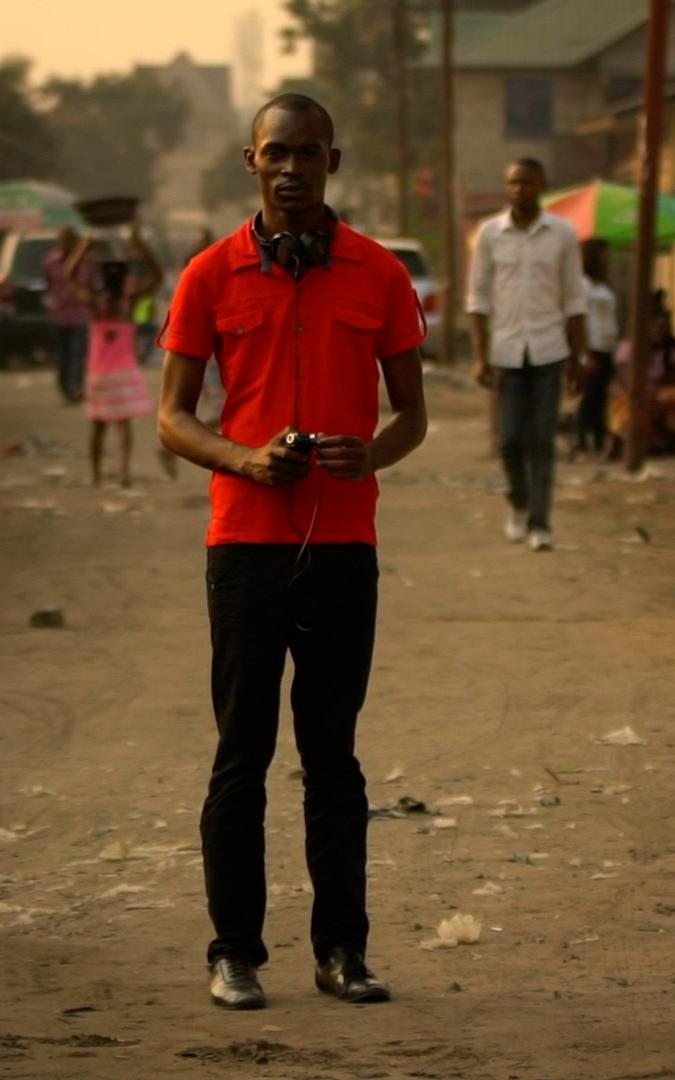 Beautiful News-Man standing still in street while other move around